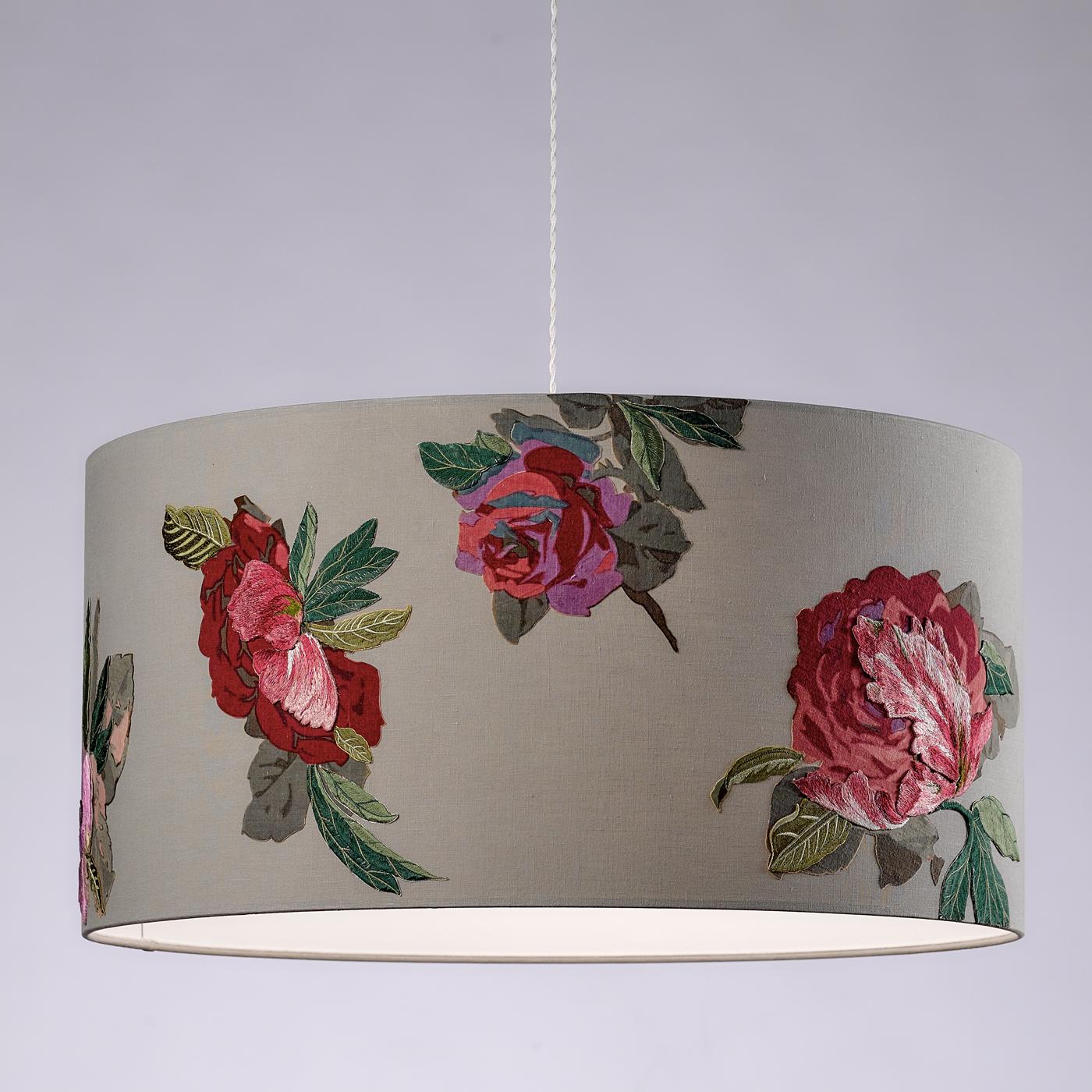 Exquisite hand-embroidered leaves and silk flowers applique' stand out elegantly on the silver gray lampshade of this vintage-inspired pendant lamp. The drum-shaped shade is made of pure linen, a sophisticated color to enhance the exquisite floral