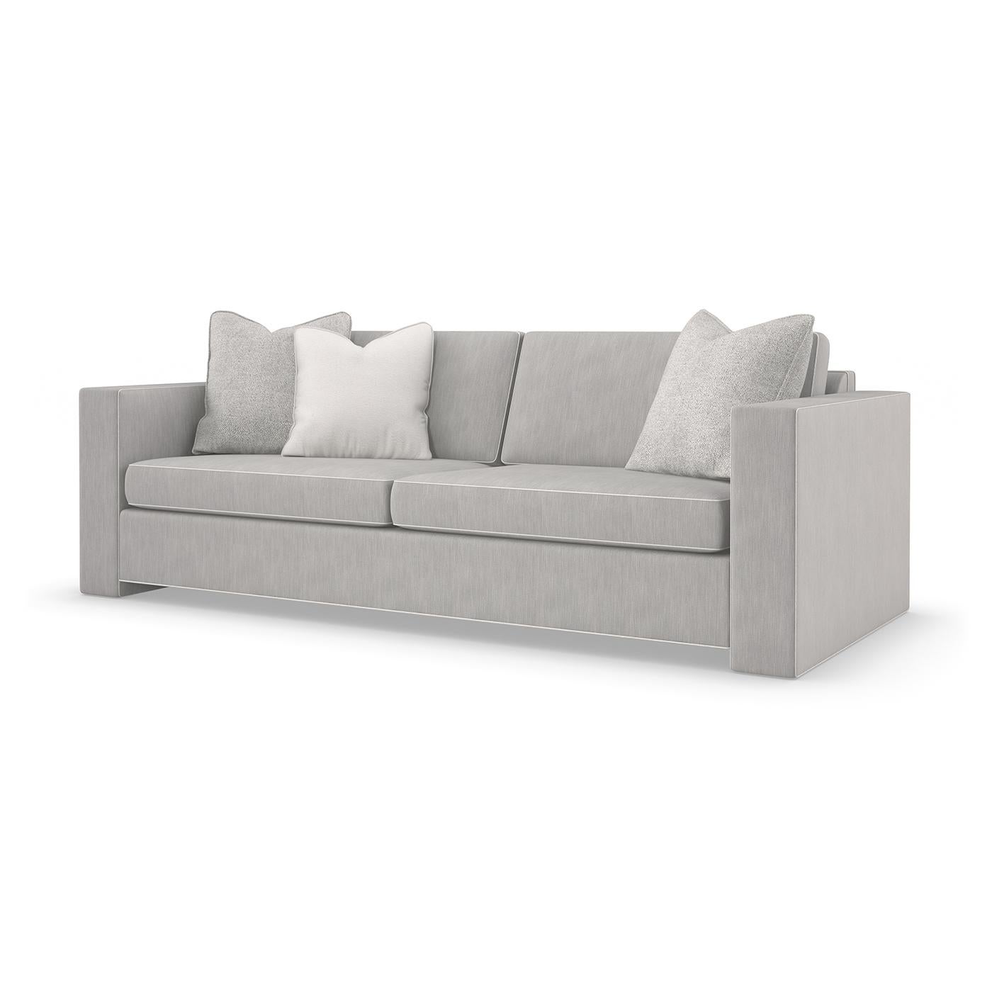 Drawing inspiration from Fashion Week in Paris, this sofa offers modern styling brought to life with warmth and texture. Tailored in a smoky taupe performance fabric, it features clean lines and linear forms outlined with contrasting welts in a
