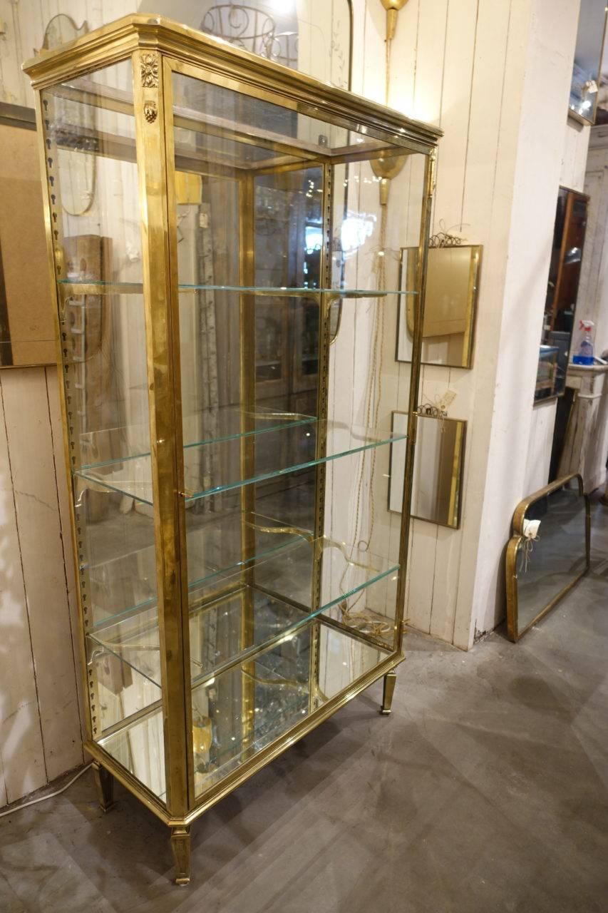 Stunning Parisian display unit / shelving vitrine, from the start of the last century, with utterly divine detailing, and produced by Muller R&P Domange, 50 Rue de Chateaudun in Paris. Made of quality brass, and equipped with keys, three stunning