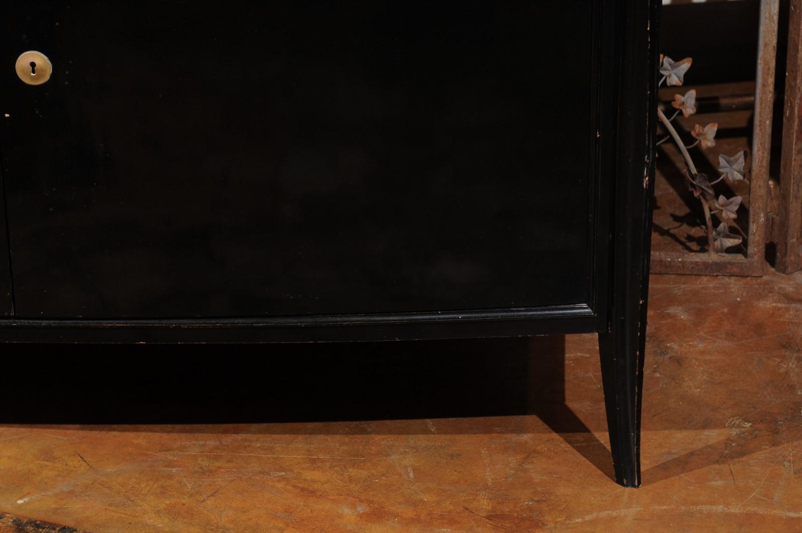 20th Century Parisian 1960s Black Lacquered Bow Front Two-Door Cabinet with Splaying Legs For Sale