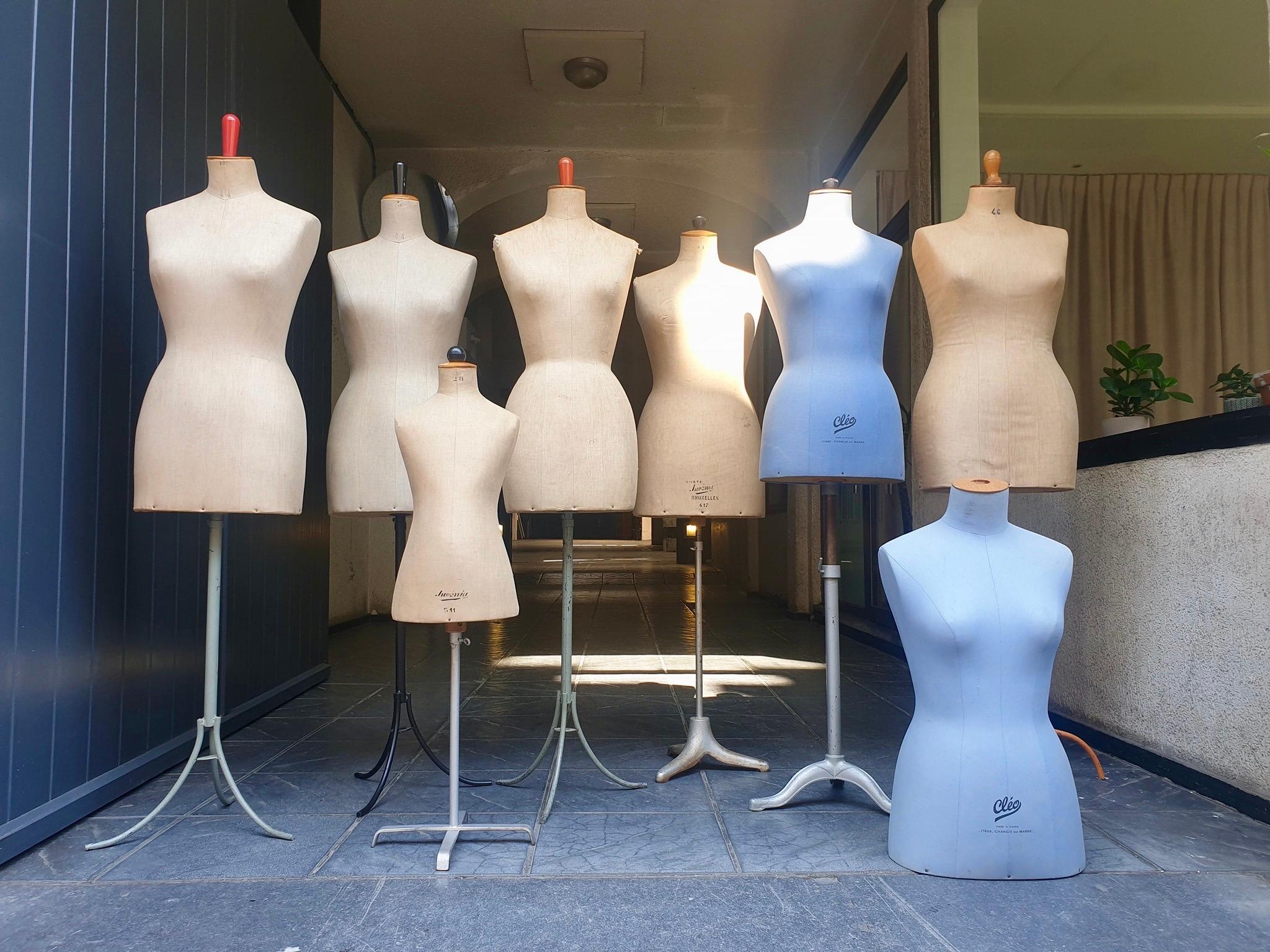 Eight old mannequins from France marked, Cléo and Belgium, Creme Lusenia Bruxelles with cast iron base.
  