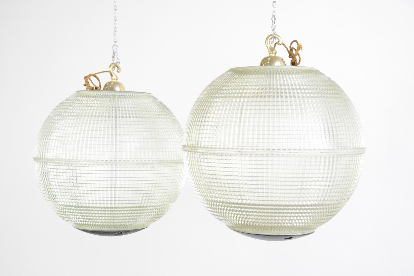 Parisian Holophane globe lights, circa 1950s

- Price is per light
- Heavy prismatic glass 
- Comes with chain and ceiling hook
- Takes E27 fitting bulbs
- Originally used on the tops of street lamps across Paris
- Made by Holophane,