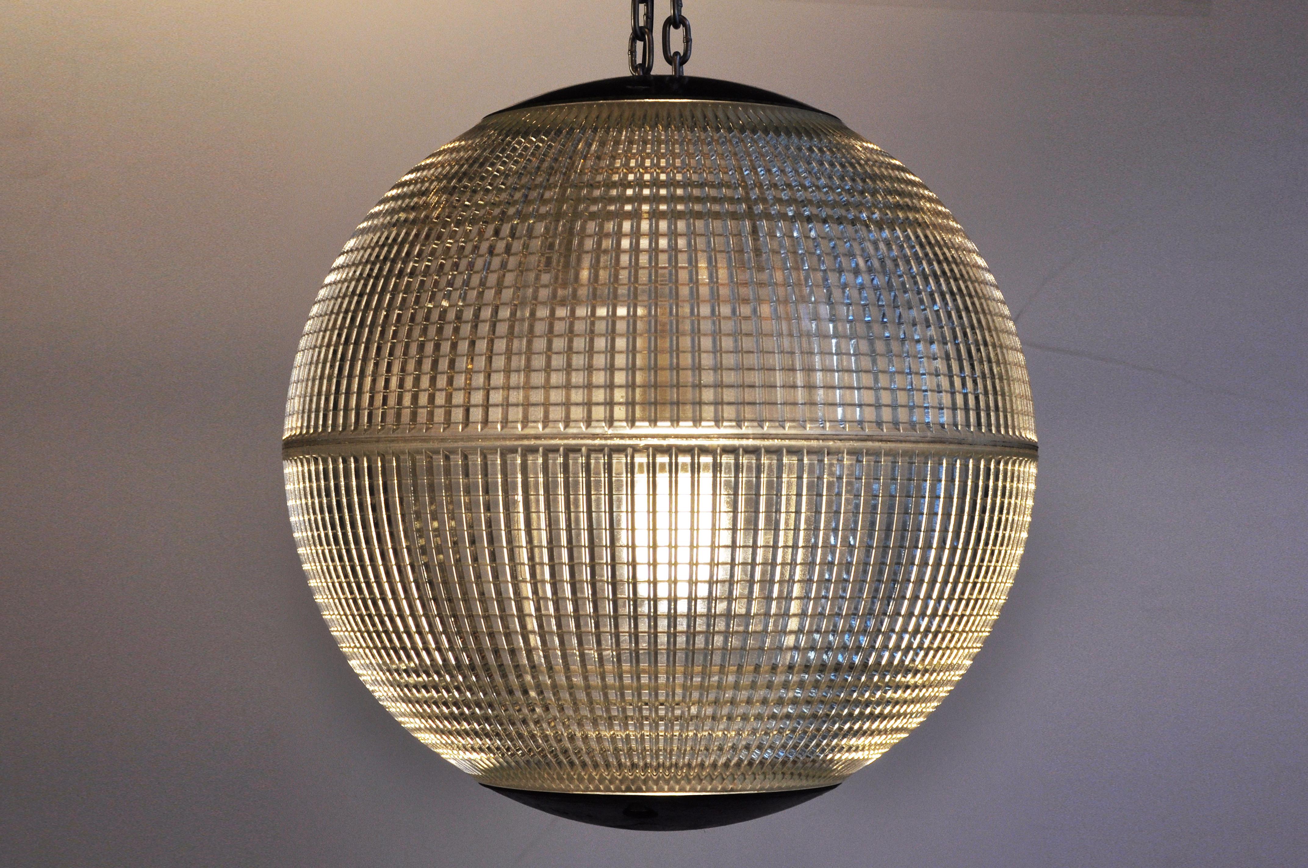 These iconic spheres once lighted the thoroughfares of Paris. Since being removed from their lampposts, these industrial globes have been rewired for modern, indoor use. They display handsomely, making a statement individually as a table or floor