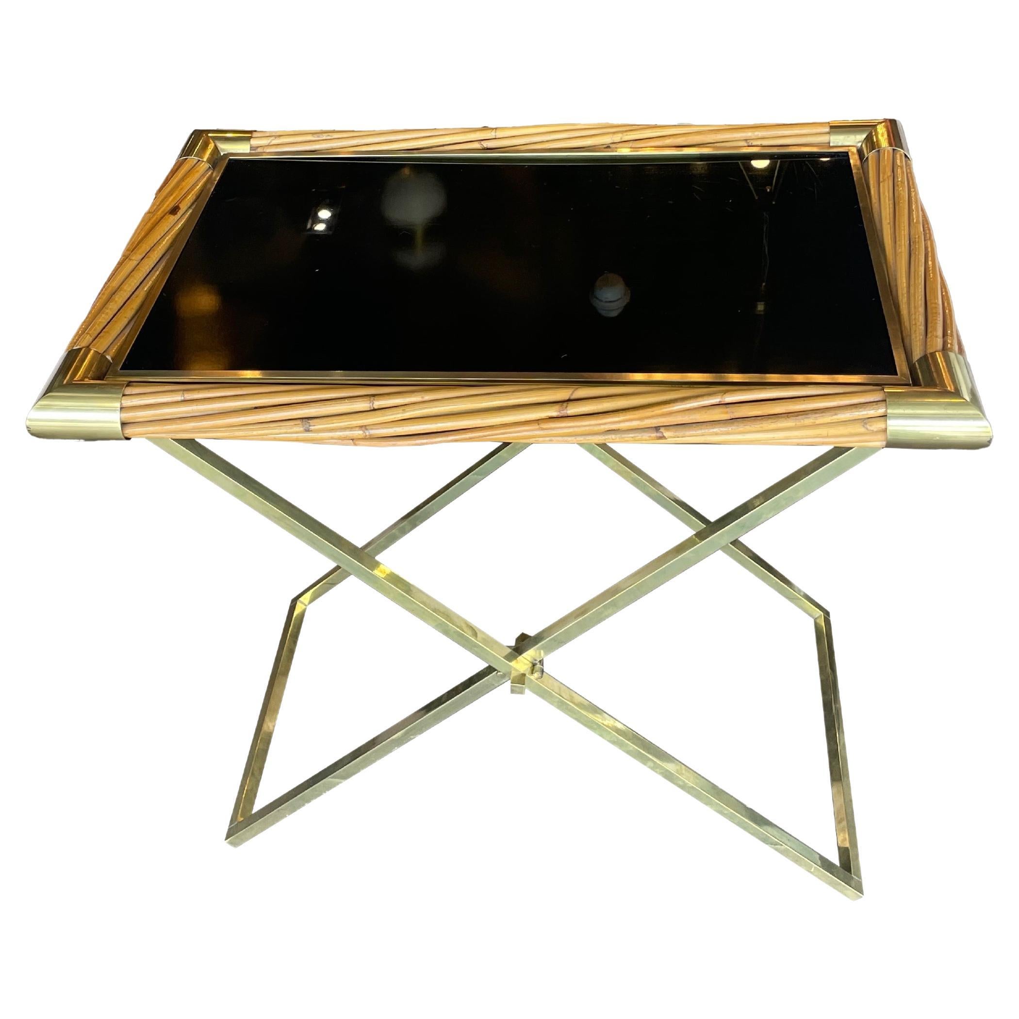 Sourced by Martyn Lawrence Bullard in Paris, France
Rattan frame, topped with blackened glass and brass hardware
Removable glass top, and original accents 

