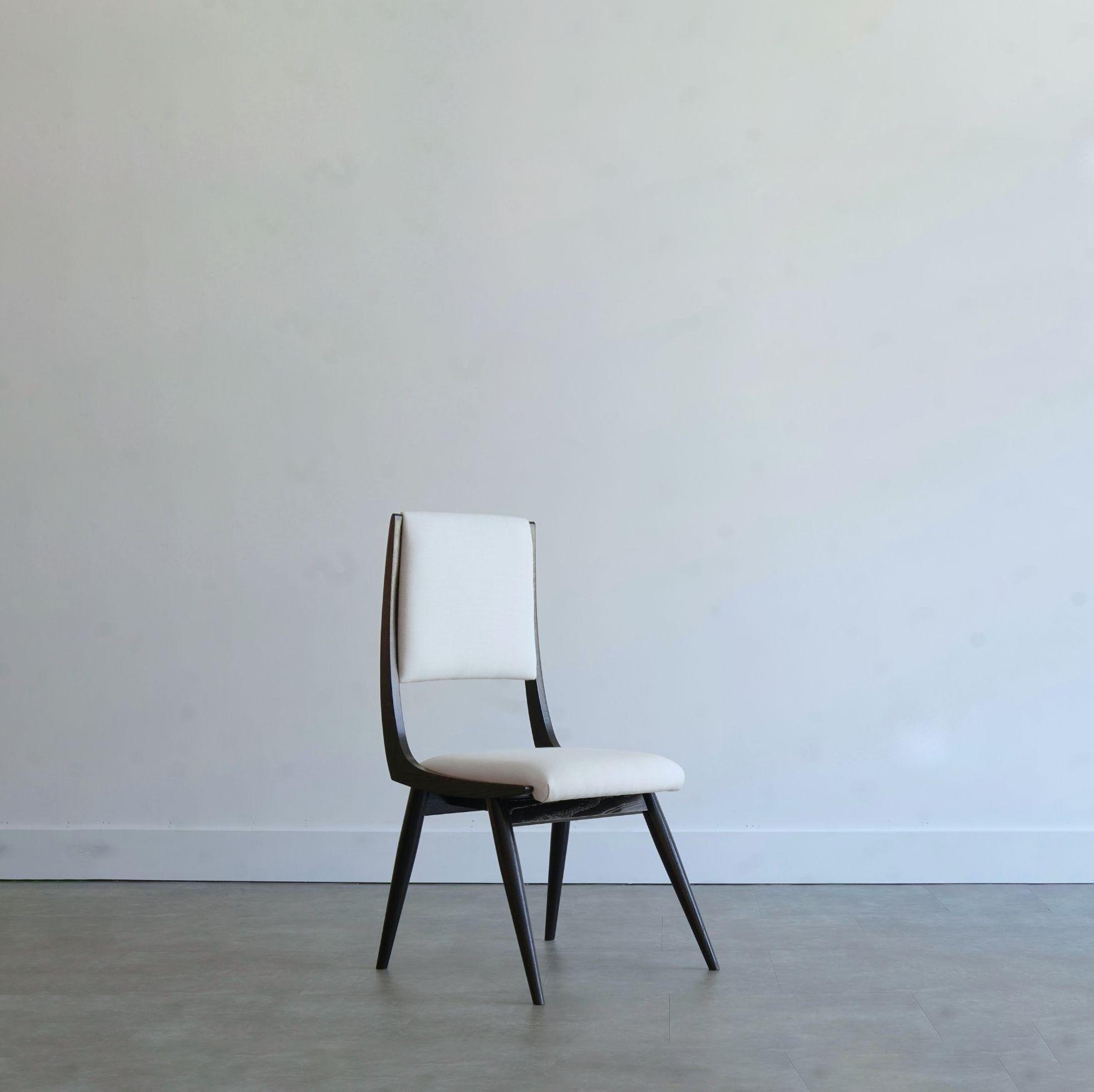 Introducing the Parisiano Chair, a timeless piece inspired by the iconic designs of Ico & Luisa Parisi. Crafted from solid walnut or oak, this chair exudes elegance and sophistication, perfect for any dining setting.

With a lead time of 12 weeks,
