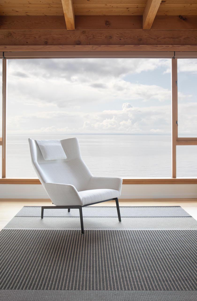 A contemporary wing-back chair. Park’s sculptural lines and inviting seat create a beautiful statement in any room.

Additional Information:
- Dimensions: D. 96 x W. 88 x H. 100 cm. 

Park and ottoman white lounge chair, by Niels Bendtsen from
