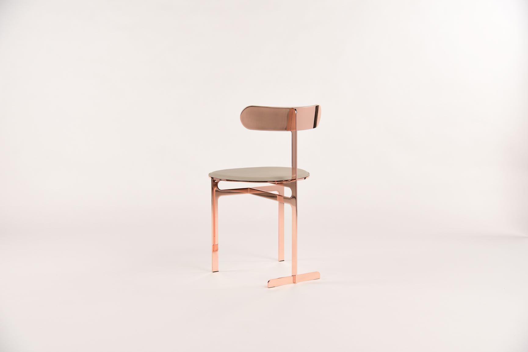 This in-stock Park Place chair by Yabu Pushelberg is presented in rose copper and pewter leather 

The Park Place design by Yabu Pushelberg is a strong statement that reflect the confidence and architecture of New York. Also available in Matte