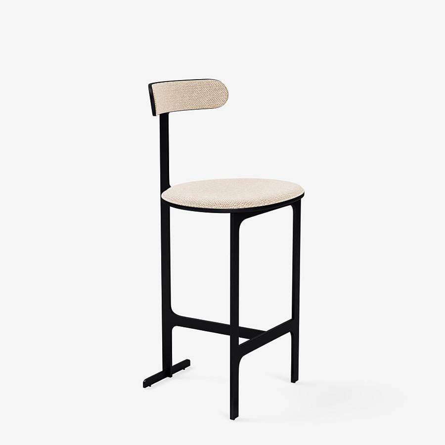 This Park Place counter stool by Yabu Pushelberg in black soft touch is upholstered in Aberdeen Avenue boucle chenille blend. Aberdeen Avenue comes in 7 colorways from Italy with a composition of 43% Viscose, 17% Polyacrylic, 15% Wool, 9% Cotton, 8%