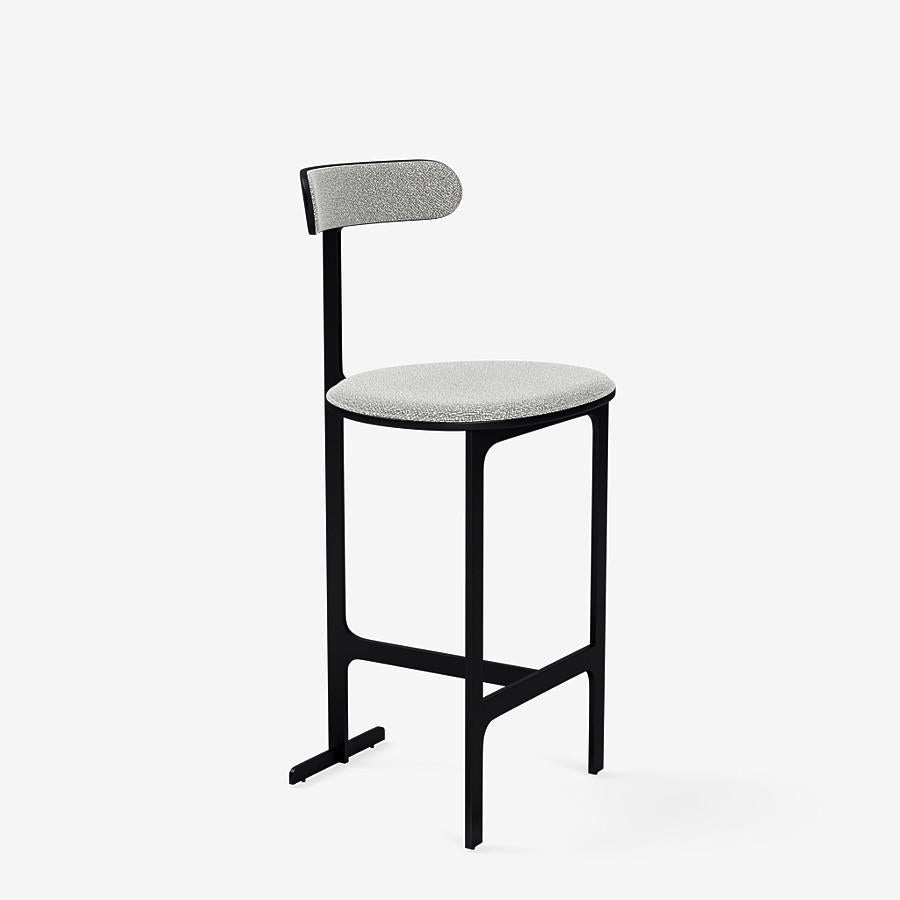 This Park Place counter stool by Yabu Pushelberg in black soft touch is upholstered in Dermott Place boucle wool. Dermott Place comes in 4 colorways from Italy with a composition of 42% Wool, 33% Viscose, 24% Cotton and 1% Polyamid, a weight of