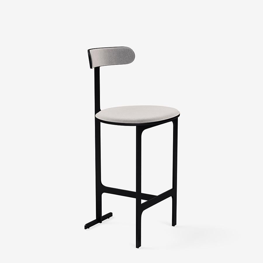 This Park Place counter stool by Yabu Pushelberg in black soft touch is upholstered in Bagdat Caddesi, silky, soft pile mohair. Bagdat Caddesi comes in 7 colorways from Italy with a composition of 100% mohair, a weight of 680g/m and a Martindale of