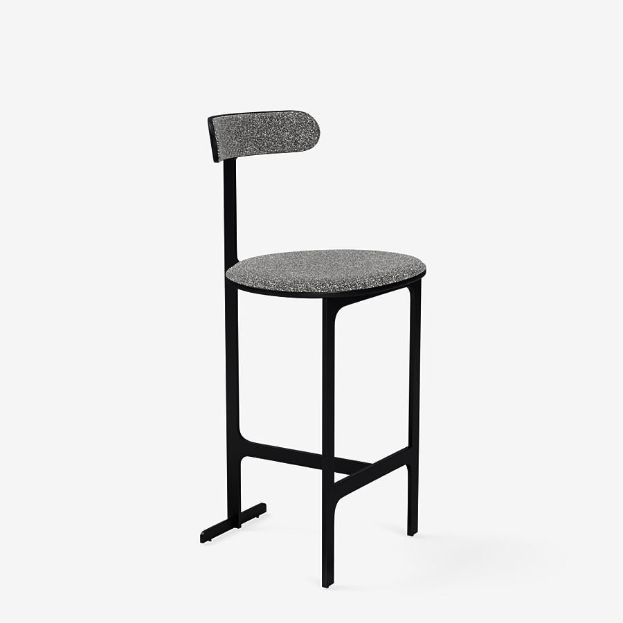 This Park Place counter stool by Yabu Pushelberg in Black Soft Touch is upholstered in Place de l'Étoile, muliti-toned bouclé. Place de l'Étoile comes in 5 colorways from Belgium with a composition of 65% Cotton, 20% Polyacrylic, 15% Polyester, a