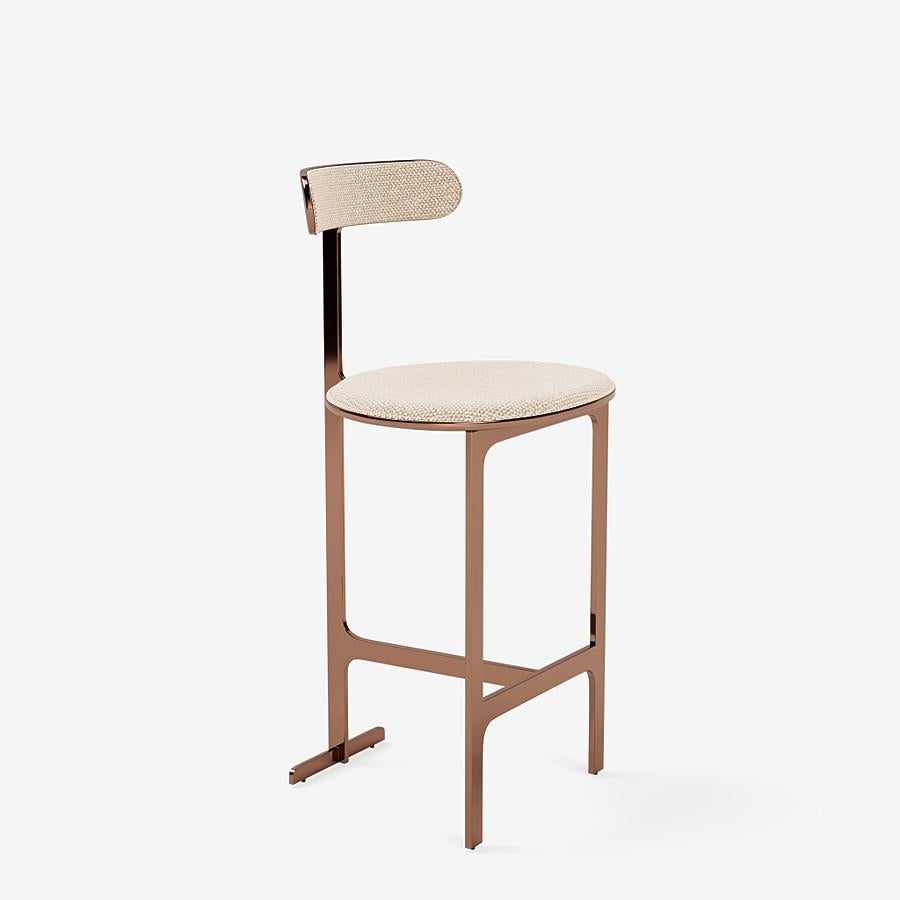This Park Place Counter stool by Yabu Pushelberg in Rose Copper is upholstered in Aberdeen Avenue boucle chenille blend. Aberdeen Avenue comes in 7 colorways from Italy with a composition of 43% Viscose, 17% Polyacrylic, 15% Wool, 9% Cotton, 8%