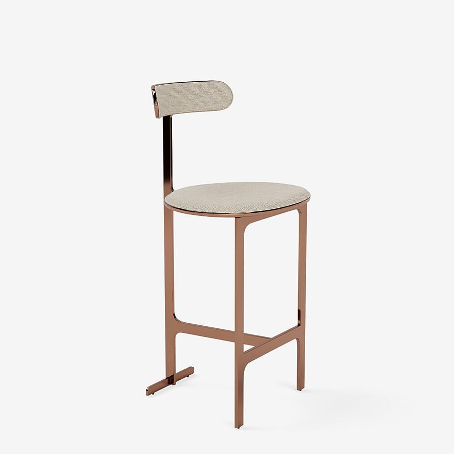 This park place counter stool by Yabu Pushelberg in rose copper is upholstered in Sumach Street twisted yarn & chenille. Sumach Street comes in 6 colorways from Belgium with a composition of 52% cotton, 22% viscose, 14% acrylic, 6% linen, 3%