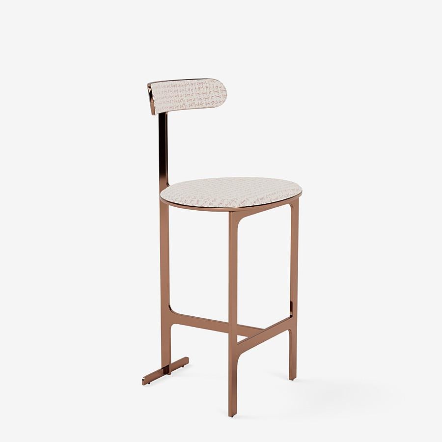 This park place counter stool by Yabu Pushelberg in rose copper is upholstered in Rue Cambon jacquard tweed, made of chenille & velour. Rue Cambon comes in 3 colorways from Italy with a composition of 43% viscose, 29% polyester, 15% nylon, 13%