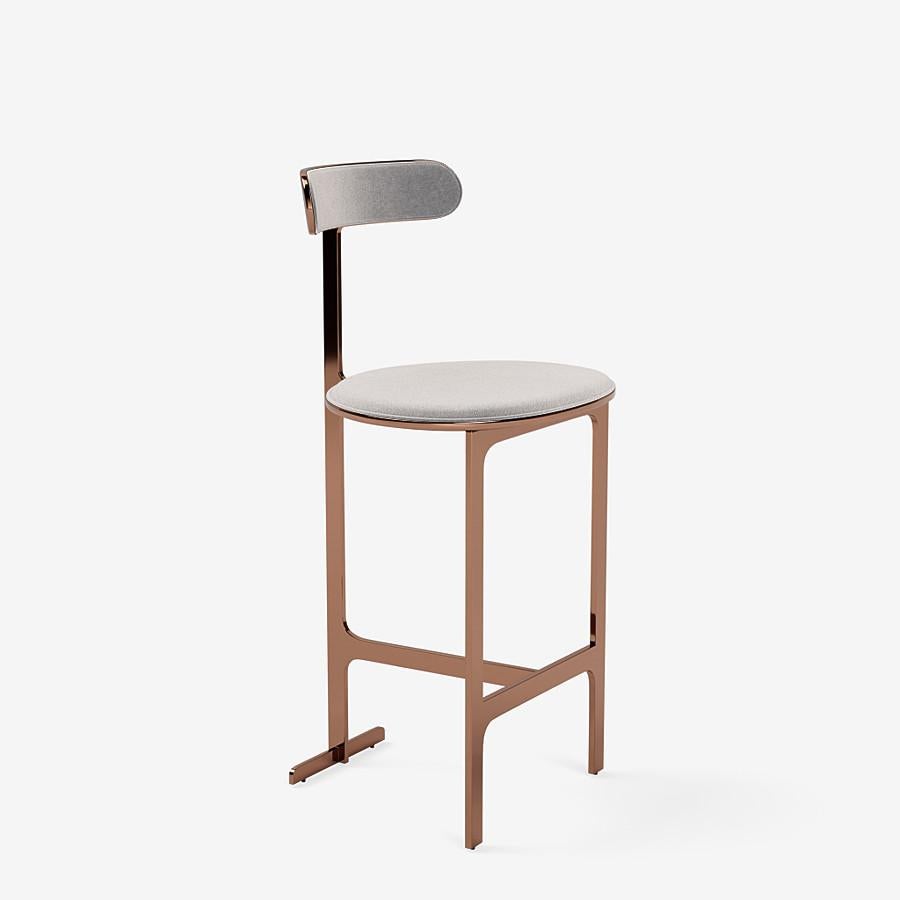 This Park Place Counter stool by Yabu Pushelberg in Rose Copper is upholstered in Bagdat Caddesi, silky, soft pile mohair. Bagdat Caddesi comes in 7 colorways from Italy with a composition of 100% mohair, a weight of 680g/m and a Martindale of