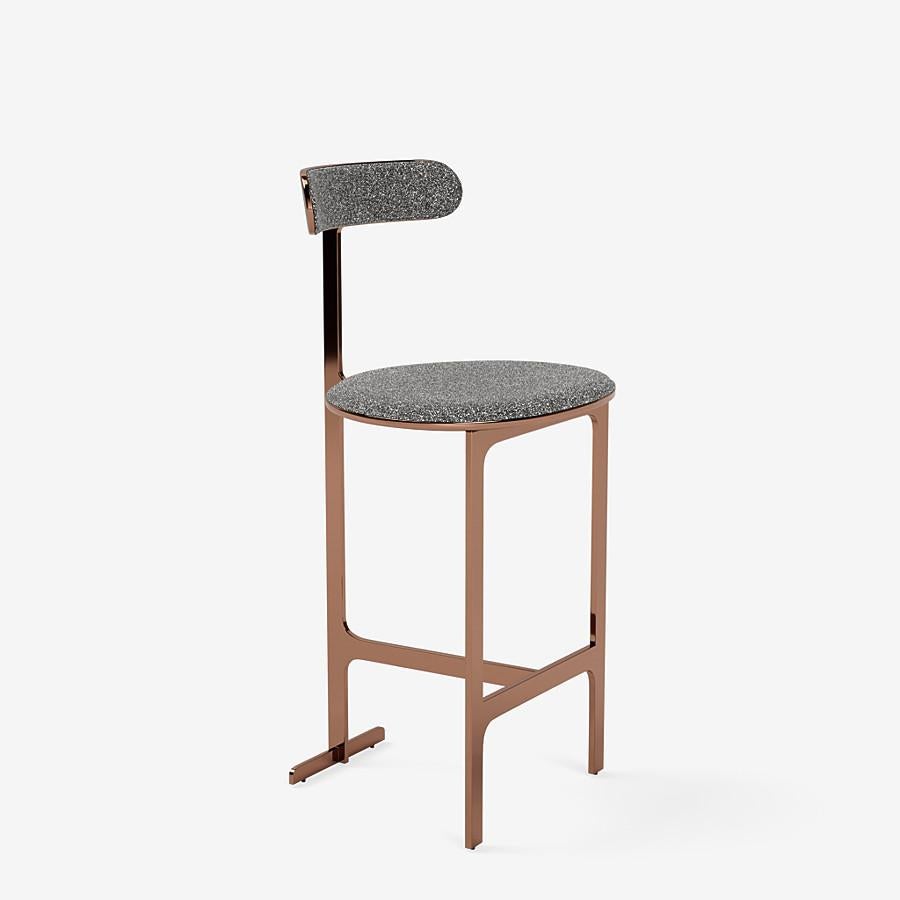This Park Place counter stool by Yabu Pushelberg in rose copper is upholstered in Place de l'Étoile, muliti-toned bouclé. Place de l'Étoile comes in 5 colorways from Belgium with a composition of 65% Cotton, 20% Polyacrylic, 15% Polyester, a weight