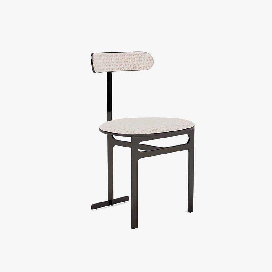This Park Place dining chair by Yabu Pushelberg in black nickel is upholstered in Rue Cambon jacquard tweed, made of chenille & velour. Rue Cambon comes in 3 colorways from Italy with a composition of 43% Viscose, 29% Polyester, 15% Nylon, 13%