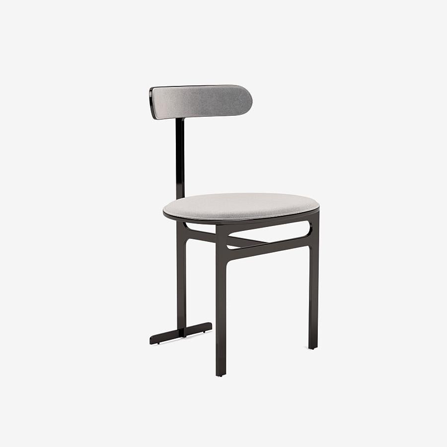 This Park Place dining chair by Yabu Pushelberg in black nickel is upholstered in Bagdat Caddesi, silky, soft pile mohair. Bagdat Caddesi comes in 7 colorways from Italy with a composition of 100% mohair, a weight of 680g/m and a Martindale of