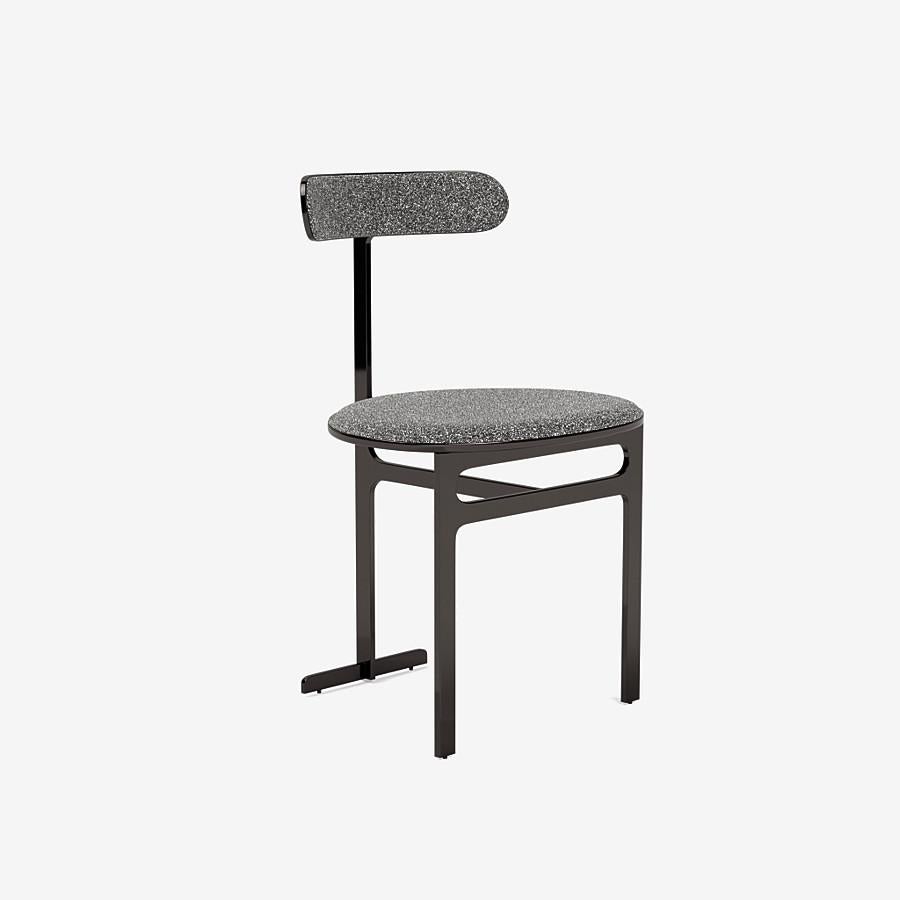This Park Place dining chair by Yabu Pushelberg in black nickel is upholstered in Place de l'Étoile, muliti-toned bouclé. Place de l'Étoile comes in 5 colorways from Belgium with a composition of 65% Cotton, 20% Polyacrylic, 15% Polyester, a weight