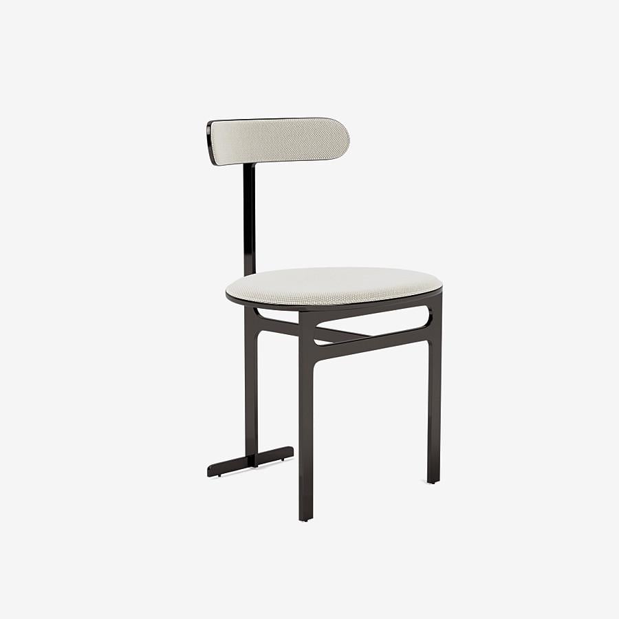 This Park Place dining chair by Yabu Pushelberg in black nickel is upholstered in Geneva Avenue textured wool. Geneva Avenue comes in 5 colorways from Germany with a composition of 96% Virgin Wool and 4% Polyamide, a weight of 1010g/m and a