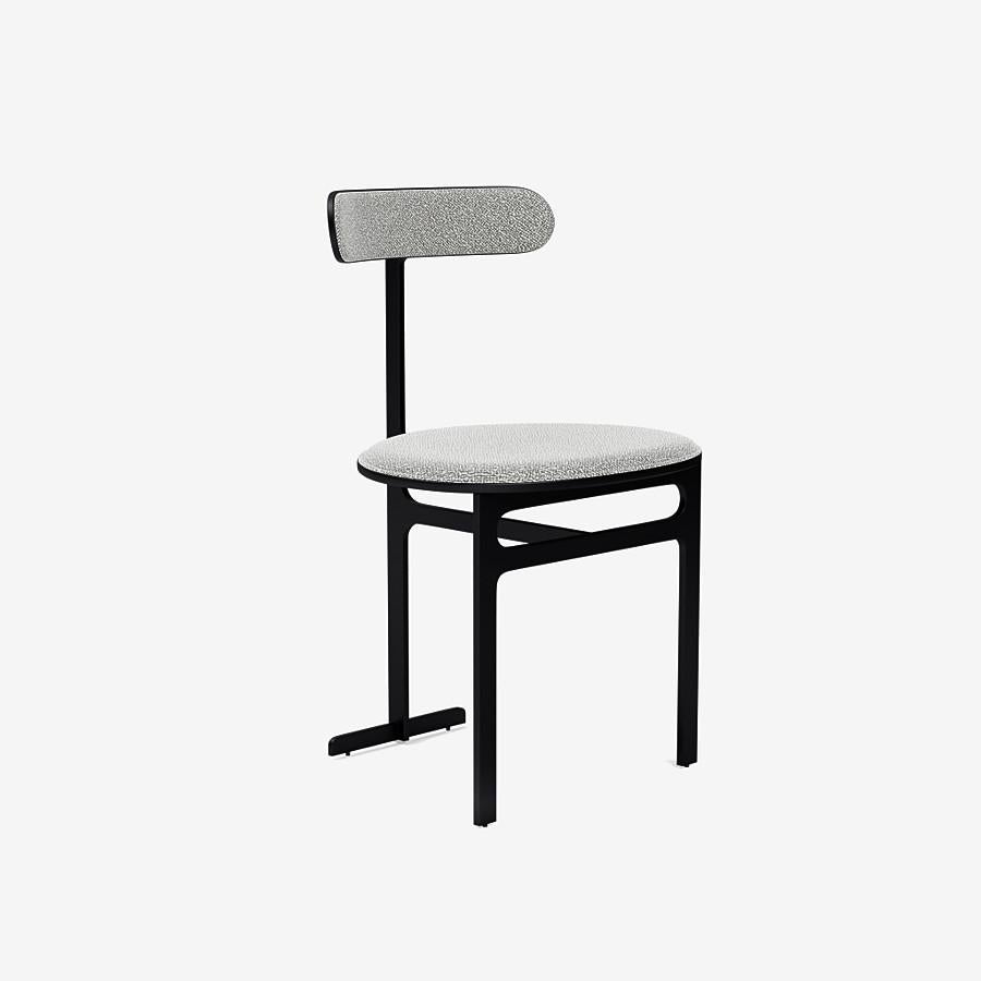 This Park Place dining chair by Yabu Pushelberg in black soft touch is upholstered in dermott place boucle wool. Dermott Place comes in 4 colorways from Italy with a composition of 42% wool, 33% viscose, 24% cotton and 1% polyamid, a weight of