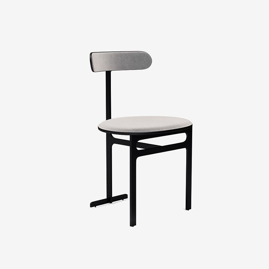 This Park Place dining chair by Yabu Pushelberg in black soft touch is upholstered in Bagdat Caddesi, silky, soft pile mohair. Bagdat Caddesi comes in 7 colorways from Italy with a composition of 100% mohair, a weight of 680g/m and a Martindale of