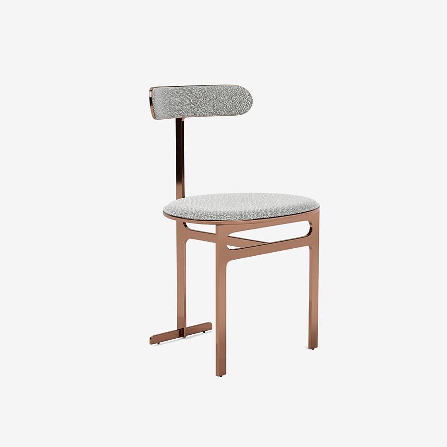 This Park Place dining chair by Yabu Pushelberg in Rose Copper is upholstered in Dermott Place boucle wool. Dermott Place comes in 4 colorways from Italy with a composition of 42% Wool, 33% Viscose, 24% Cotton and 1% Polyamid, a weight of 1040g/m