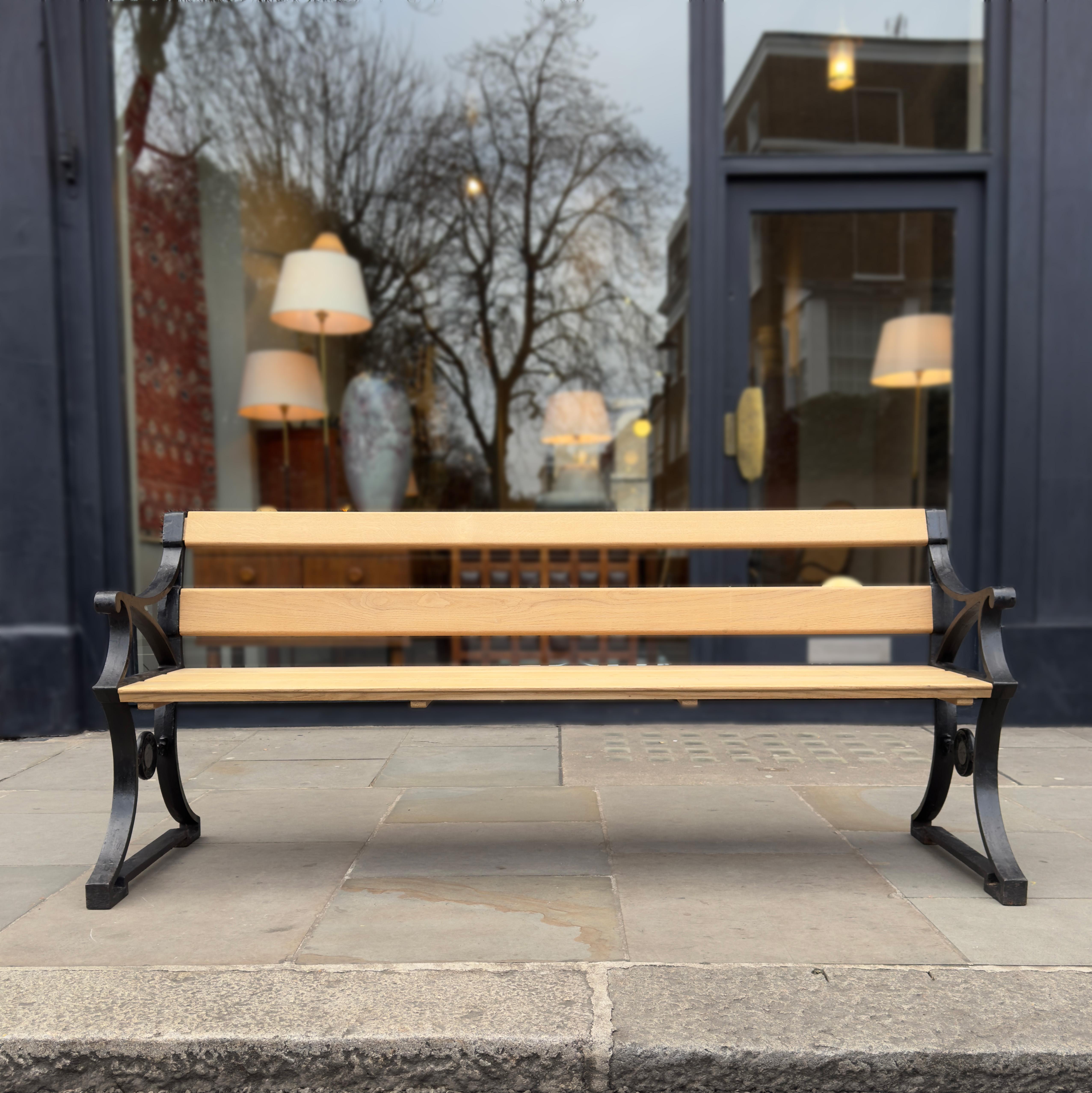 An original Nr. 3 Parkbänk designed by Folke Bensow for Näfveqvarns Bruk in the 1920s.

The cast iron ends to the bench show fine craftsmanship, with their design pulling away from their heavy medium. The lower half is decoratively braced with a