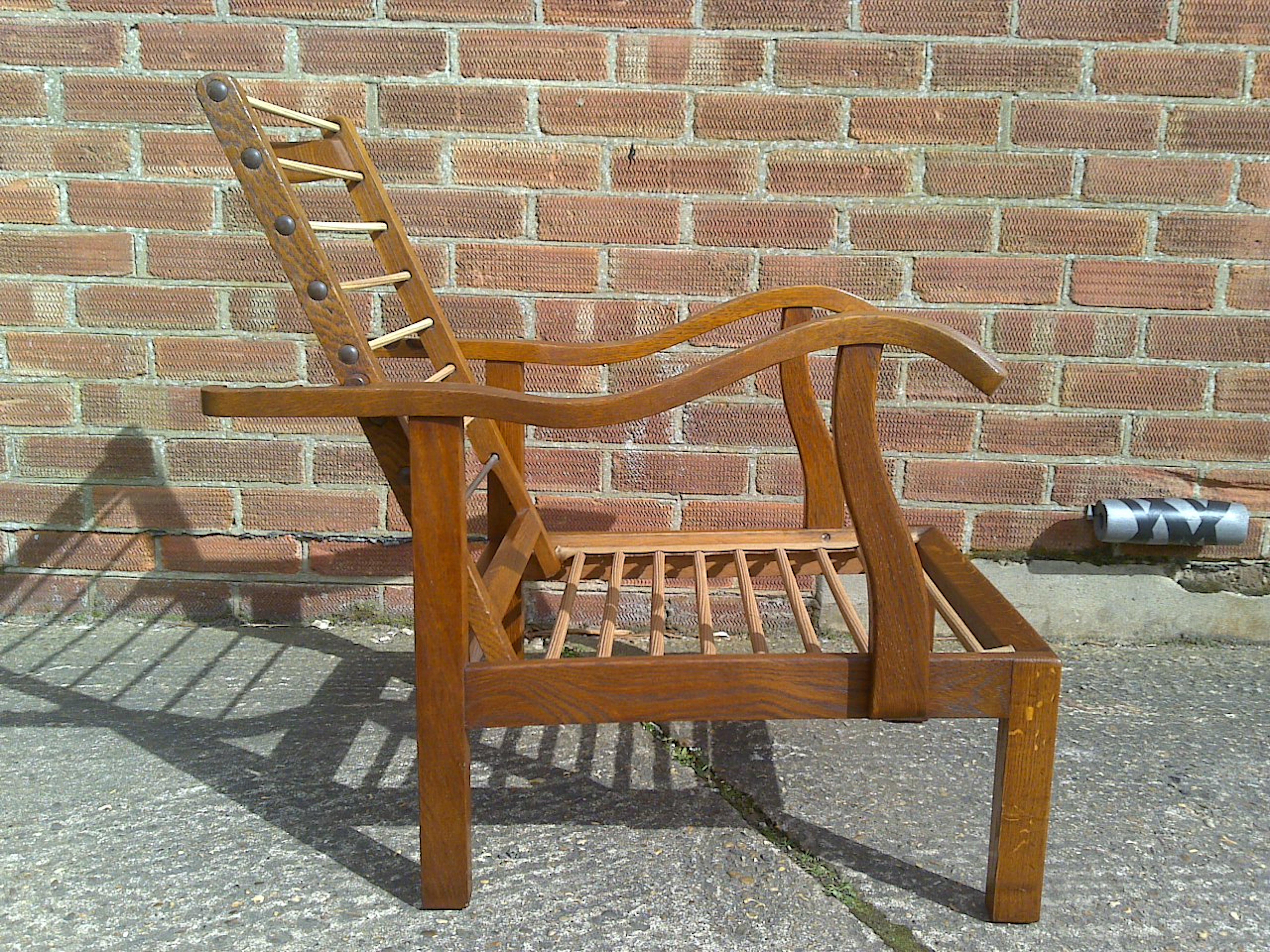 Arts and Crafts Parker Knoll, Mid-Century English Arts & Crafts Style Oak Reclining Armchair For Sale