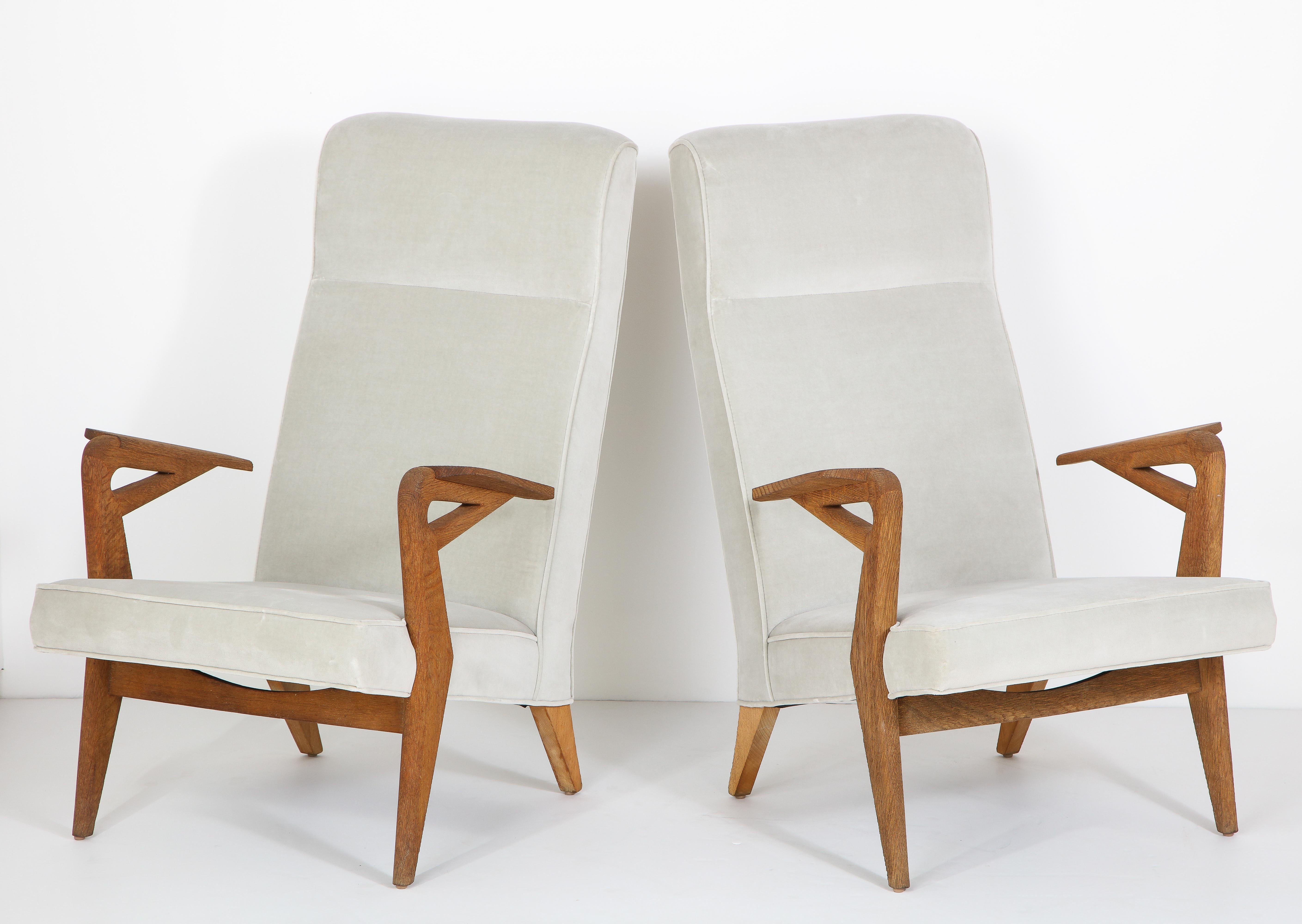 Parker-Knoll raw oak armchairs freshly reupholstered.