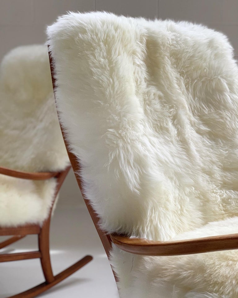 Parker Knoll Rocking Chairs with New Zealand Sheepskin Cushions, Pair