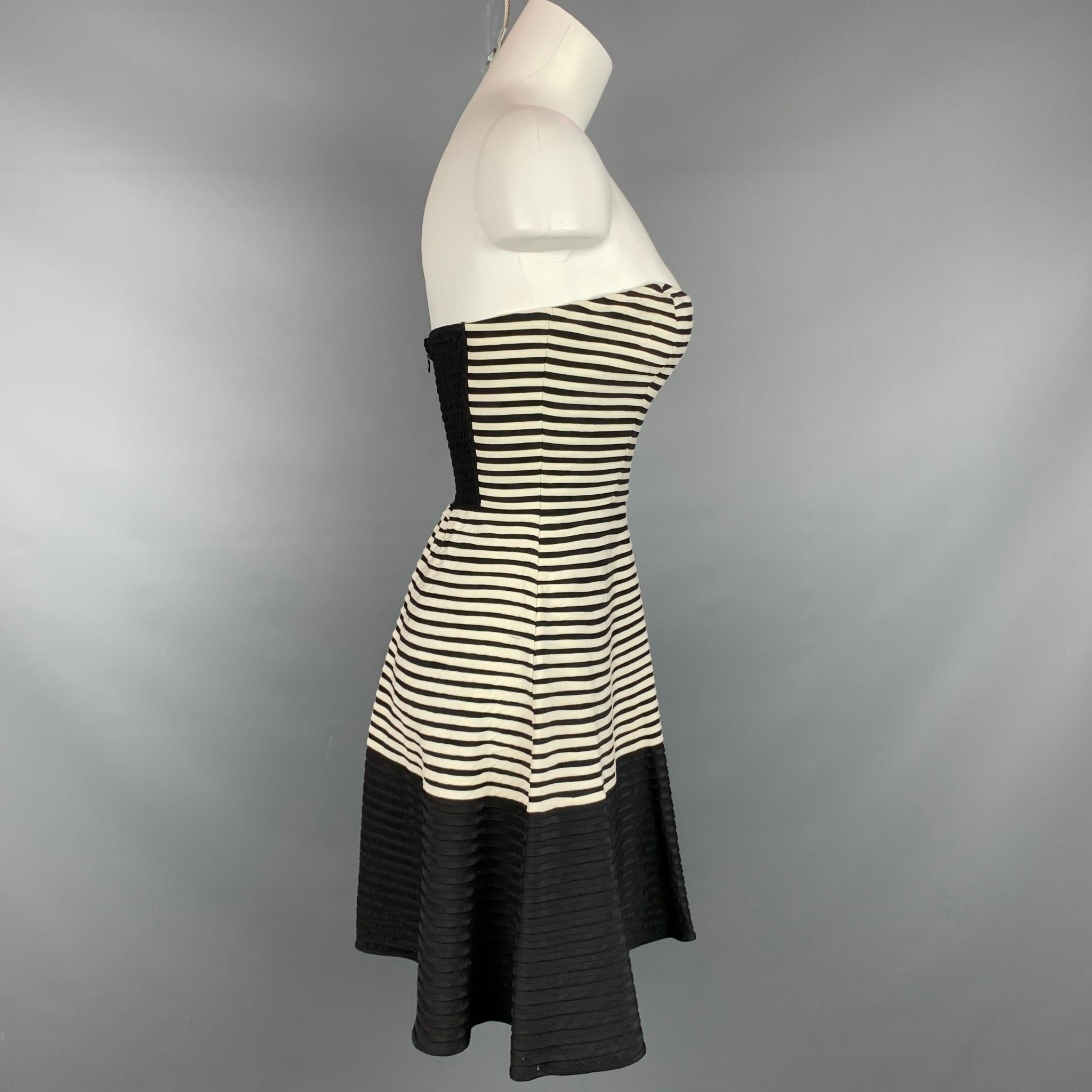 PARKER dress comes in a black & white stripe silk featuring a strapless style, circle skirt, and a back zipper closure. 

New With Tags.
Marked: XS
Original Retail Price: $297.00

Measurements:

Bust: 28 in.
Waist: 22 in.
Hip: 36 in.
Length: 24.5