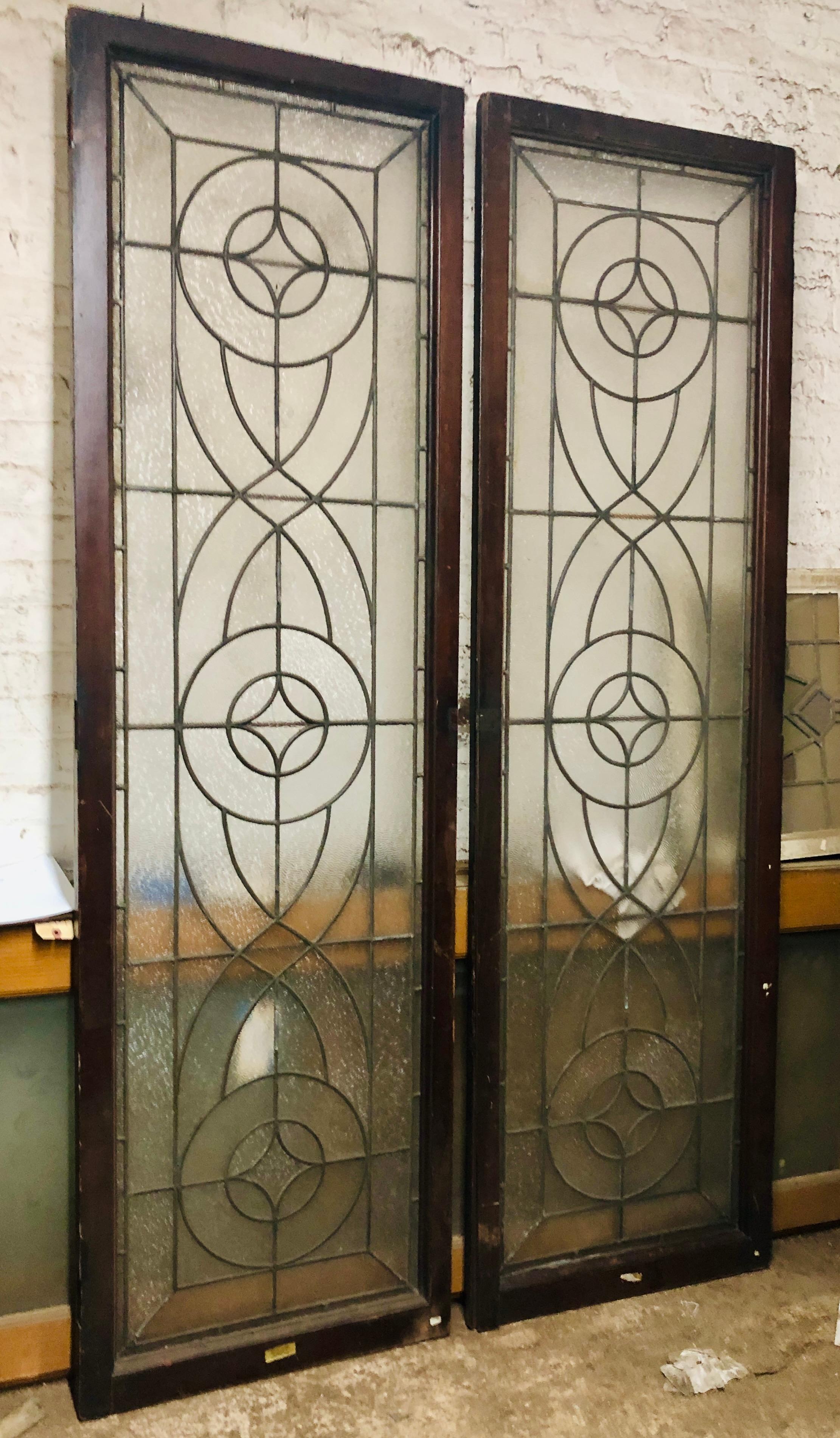 Pair of doors over six feet tall with ripple textured glass and leaded design. Each door is 24.5