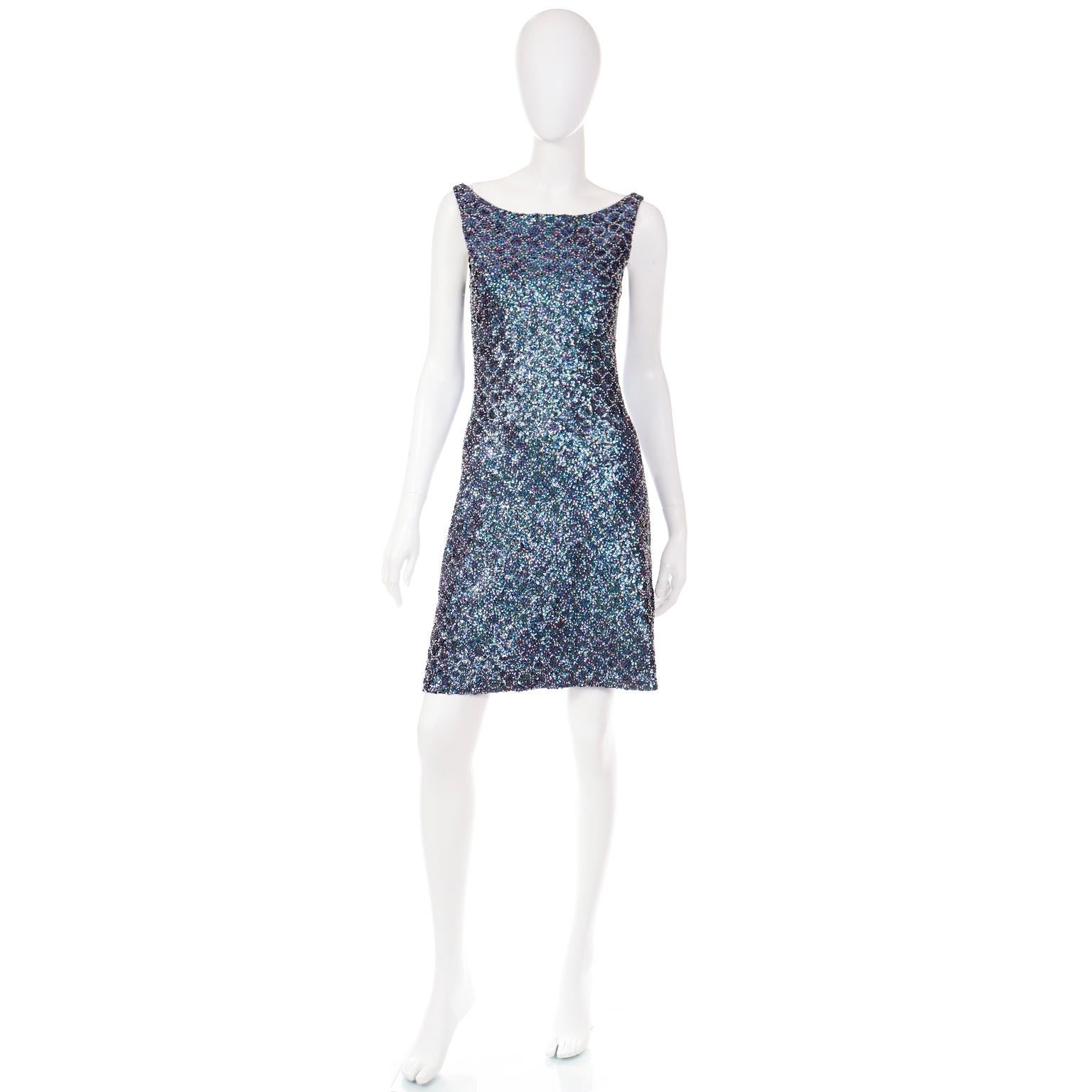 This really fun Parosh evening dress is covered in white and iridescent purple and blue beads and sequins. This easy to wear dress is such a great piece to have in your closet! The base of the dress is a nylon spandex blend so there is some stretch