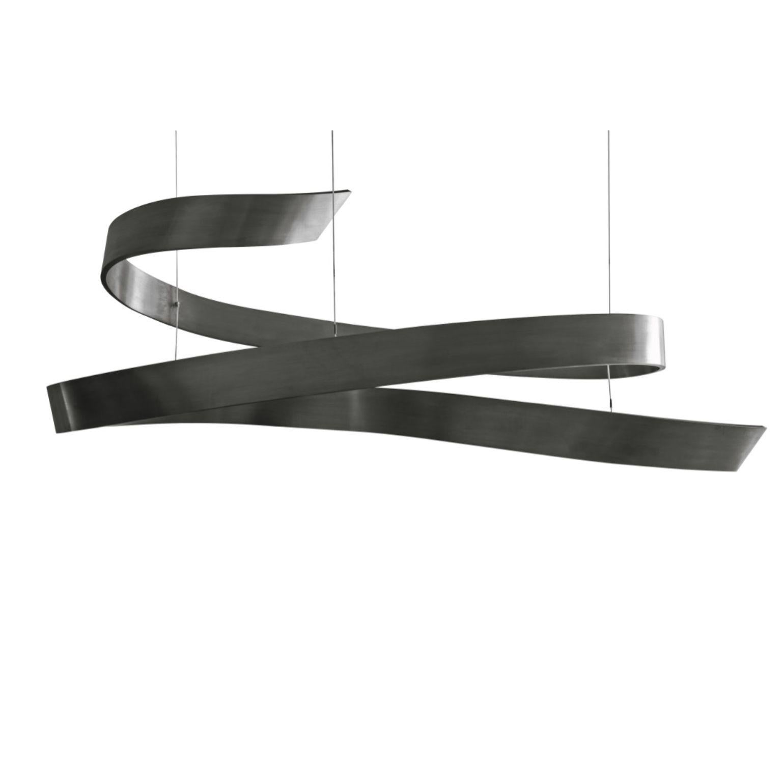 Parques Ribbon Lighting Fixture by Emilie Lemardeley
Dimensions: D140 x W55 x H55 cm
Materials: metal with black patina.
Weight: 8 kg
The patina can be bronze, gold (yellow or white gold leaves), silver.

This lighting ranges refers to the