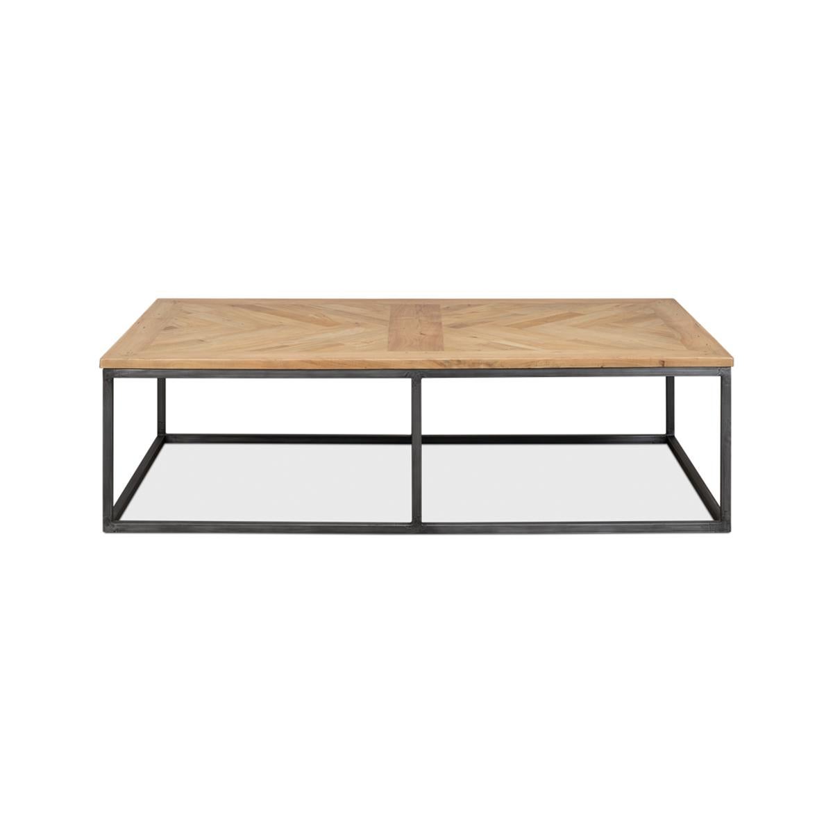 A large coffee table made with recycled wood in a parquet pattern combined with an cube form iron base gives this rectangular table a good look.

Dimensions: 65