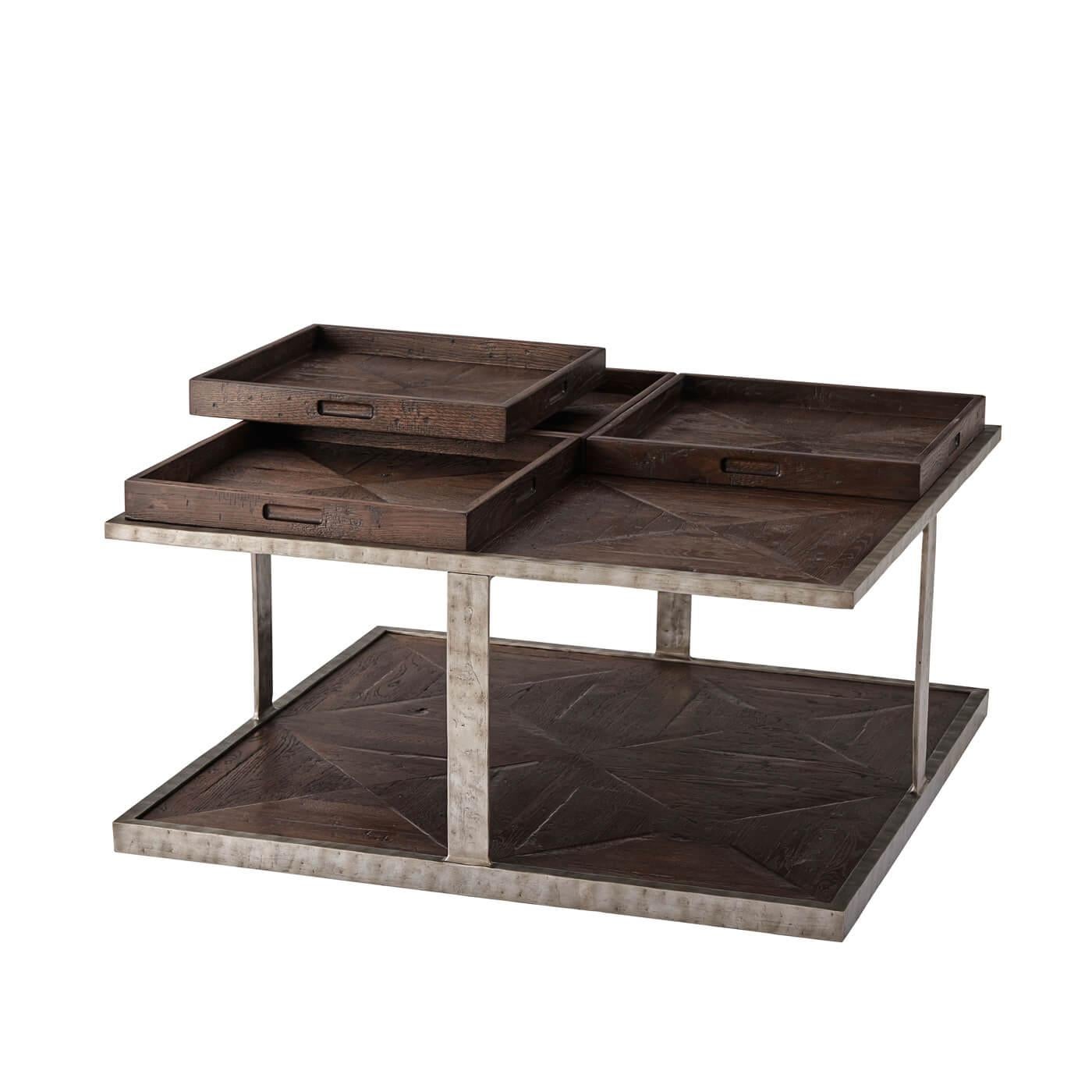 A parquetry four-tray top coffee table in 