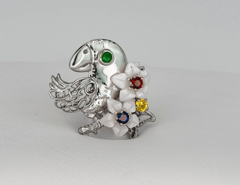 Modern Parrot gold pendant with emerald, sapphires, ruby and pearl carved flowers For Sale