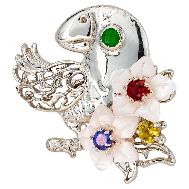 Parrot gold pendant with emerald, sapphires, ruby and pearl carved flowers For Sale