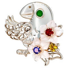 Parrot gold pendant with emerald, sapphires, ruby and pearl carved flowers!