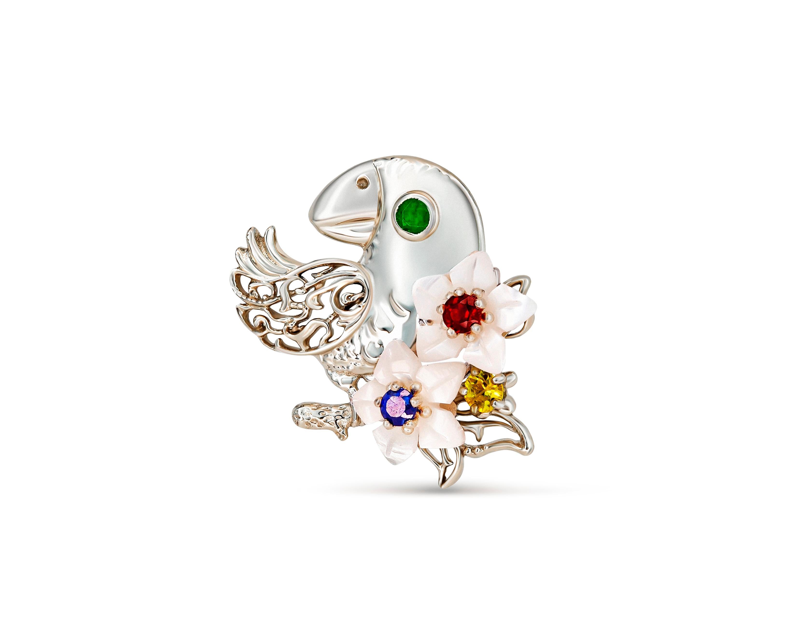 Parrot on flower pendant with colored gems. 
Emerald, sapphires, ruby 14k gold pendant. Bird, Cockatoo pendant. Carved shell flower pendant.

Metal: 14k gold
18.9x23.2 mm size
Weight 2.40 gr (pure gold weight - 2.2 gr)

Gemstones:
Emerald: green