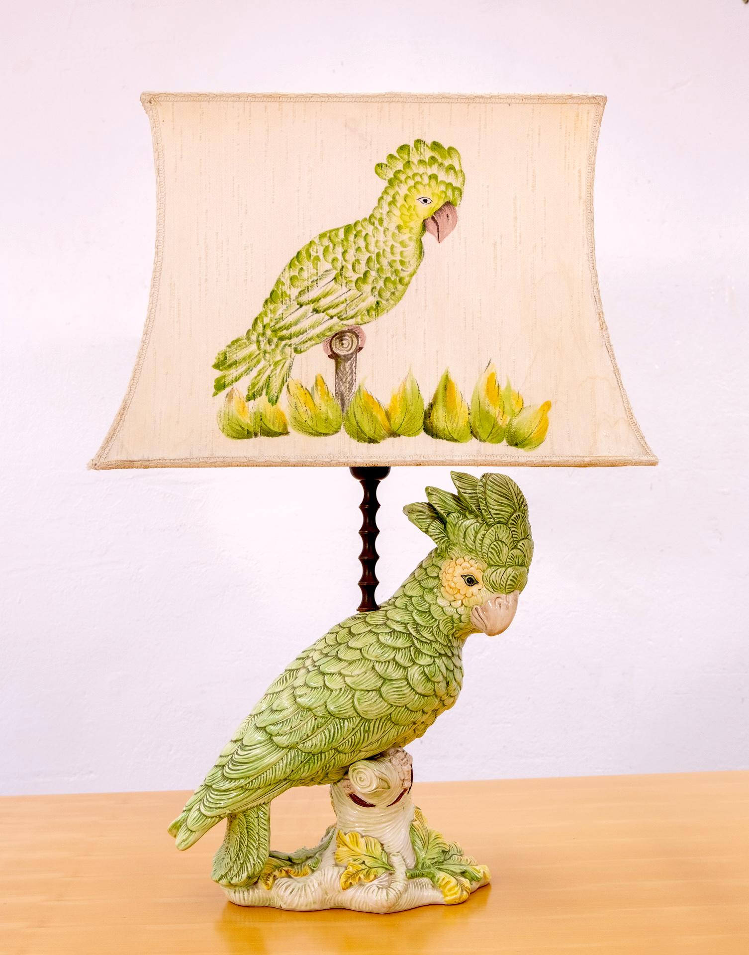 They are still together this lovely parrot and his hand painted shade. Italy, 1960s
The ceramic parrot is in a excellent condition. The shade has the normal tear and wear.
Very nice table lamp. Signed ''made in Italy''.
 