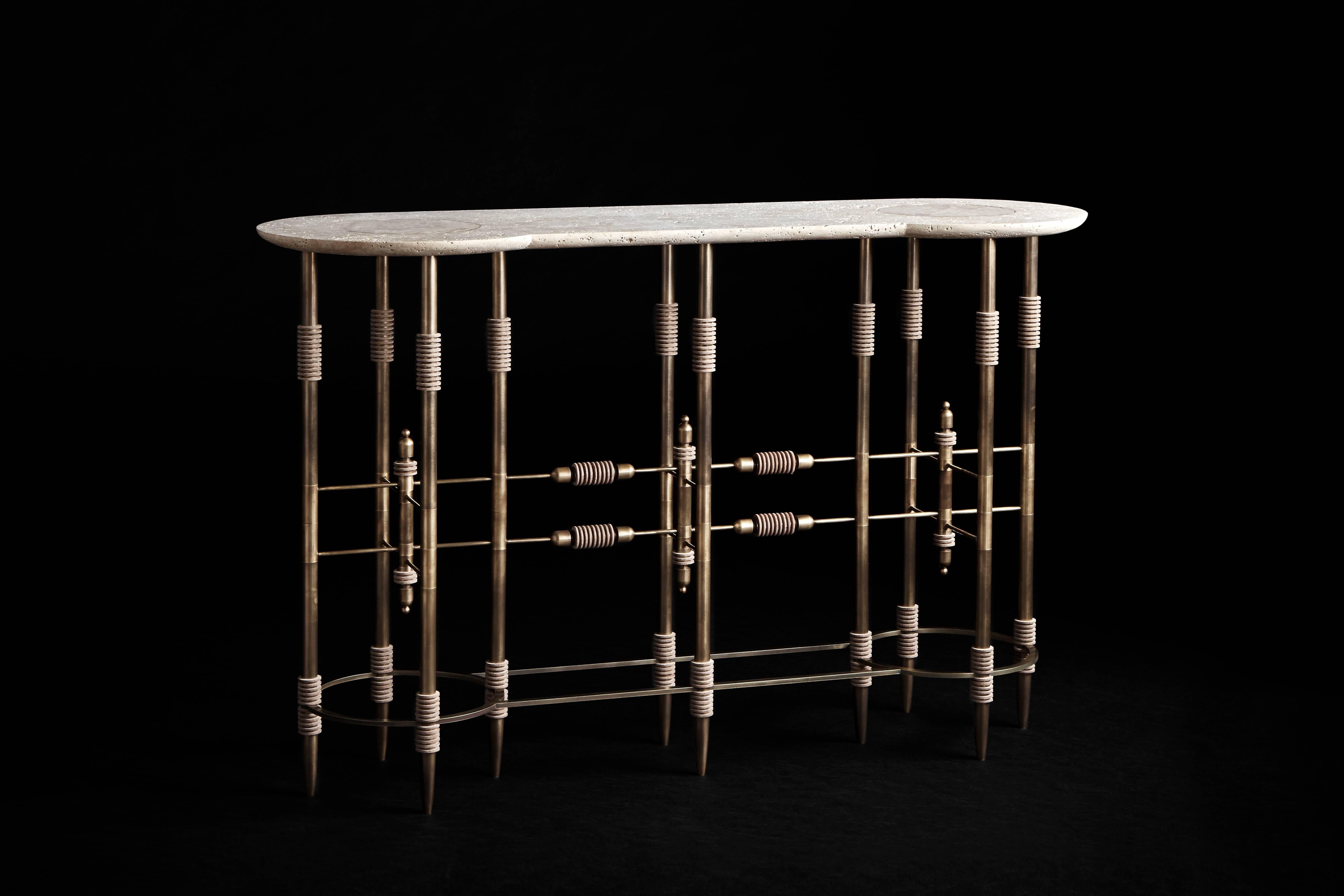 The delicate forms of the Pars series evoke nomadic tray tables found across the Middle East. Hand-cut leather disks stack along brass legs, and inset leather rounds provide soft points of interaction in the stone table surfaces.

Travertine and