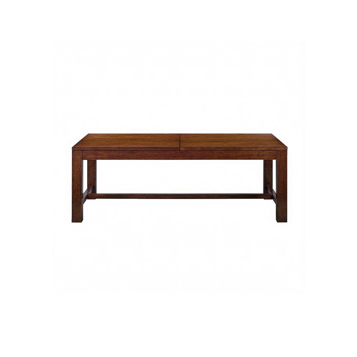 Parsons Dining Table - Mahogany Finish. This expandable dining table with an easy to open ratchet system has two self-storing leaves, has a warm country mahogany wood tone finish with natural highlights, time-worn physical distressing, and