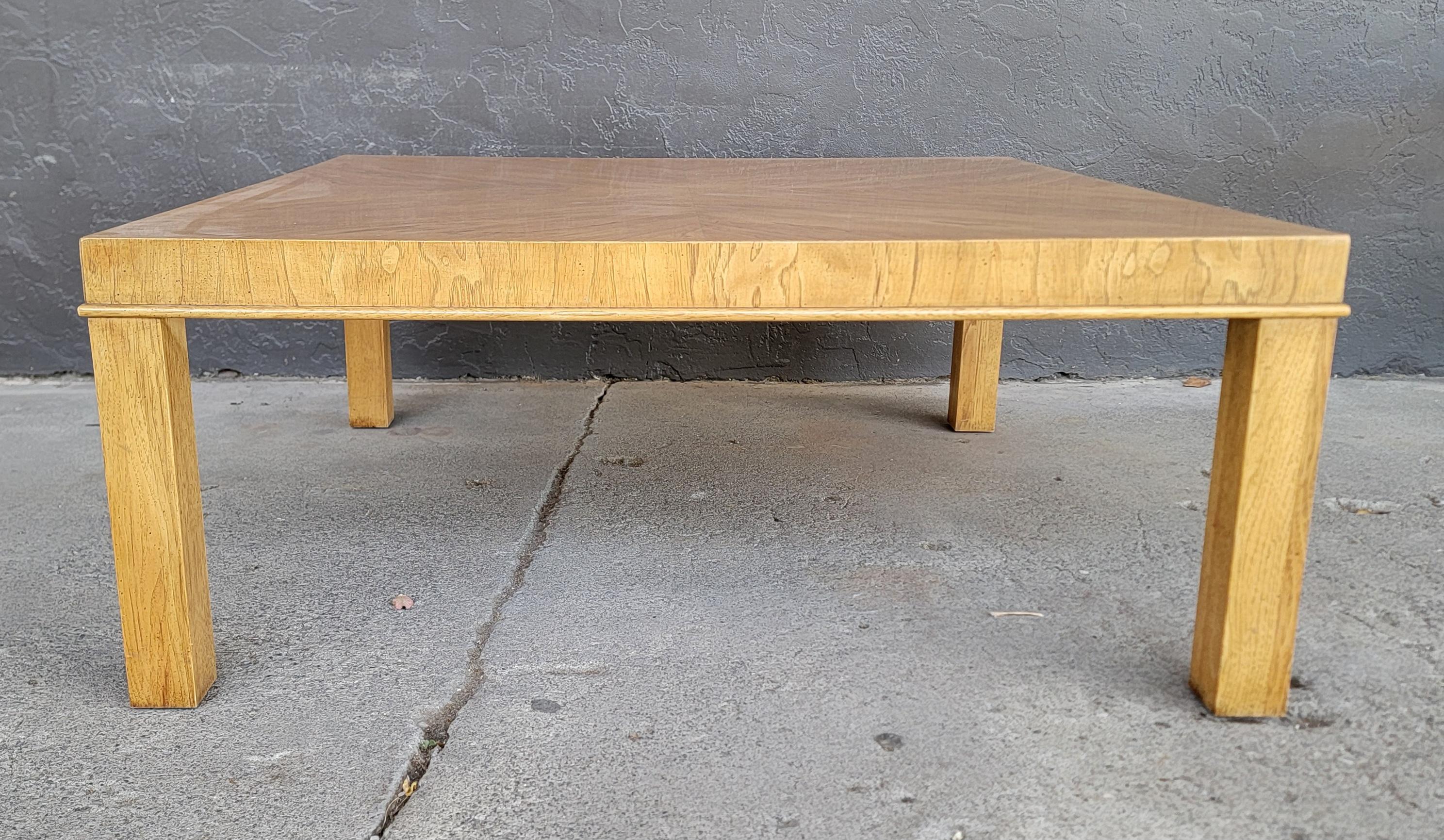 A square Parsons coffee table designed in the manner of Milo Baughman. Book-Matched wood grain 4 panel top surface. Laminated, but solid oak legs. Quality crafted with all wood construction. In exceptional, original vintage condition with original