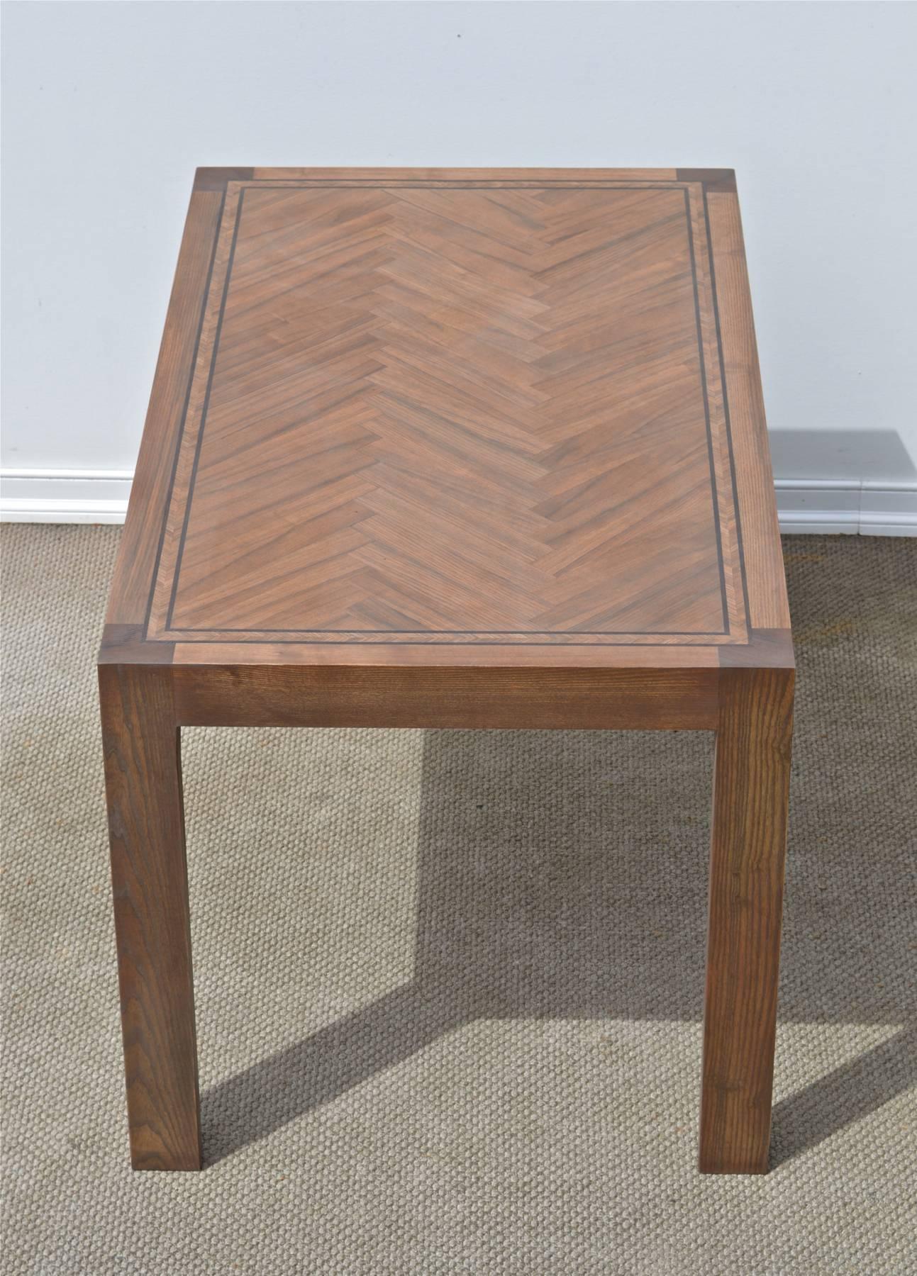 Bench made parsons style dining table of oak. Gorgeous herringbone inlay on the top. 
Custom sizes and finishes available.