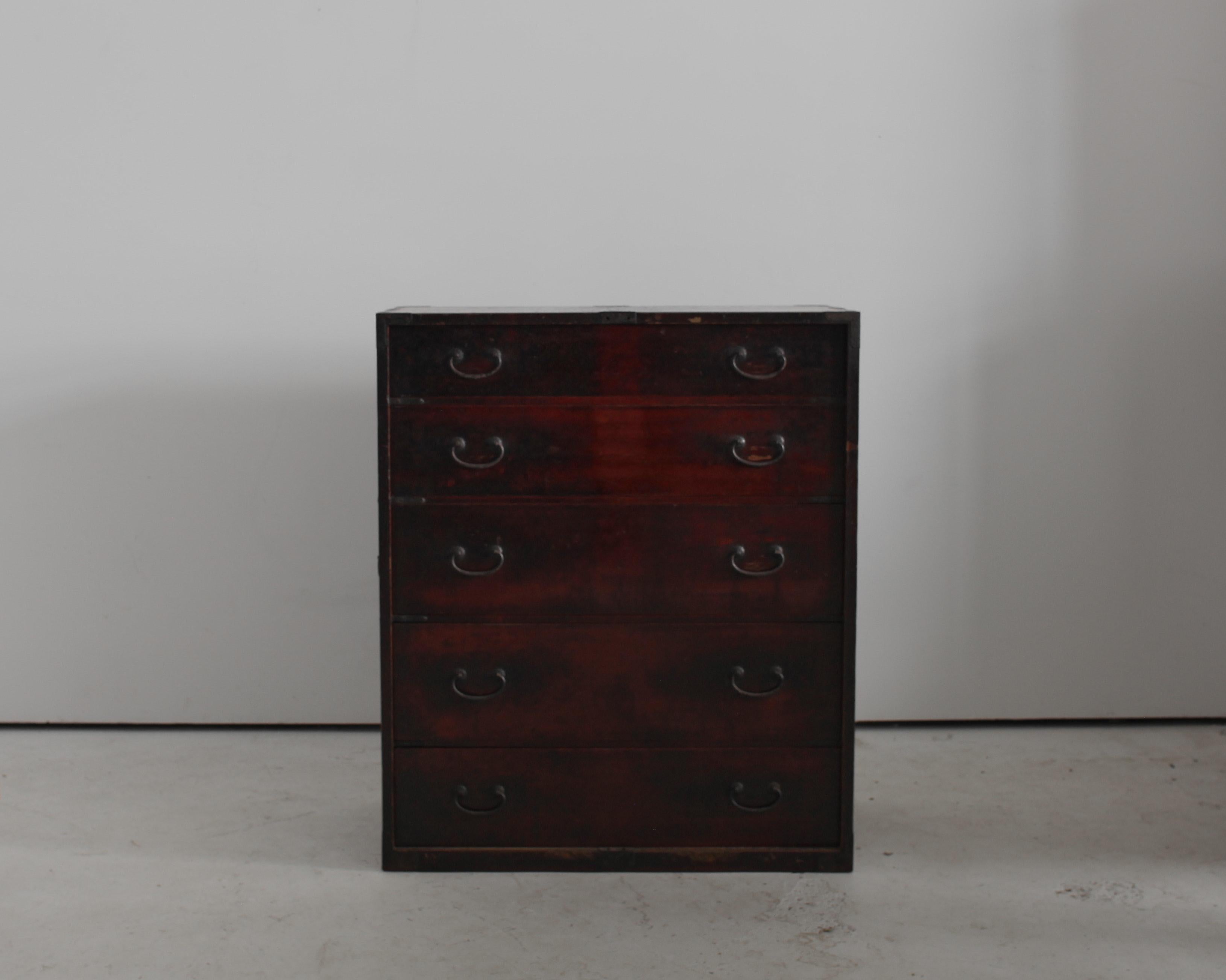 A tall, 5 drawer part charred cedar & elm Japanese tansu from the early 19th C.

Both a beautiful & very practical piece of furniture.

Heavy patinated through years of use with original iron hardware.