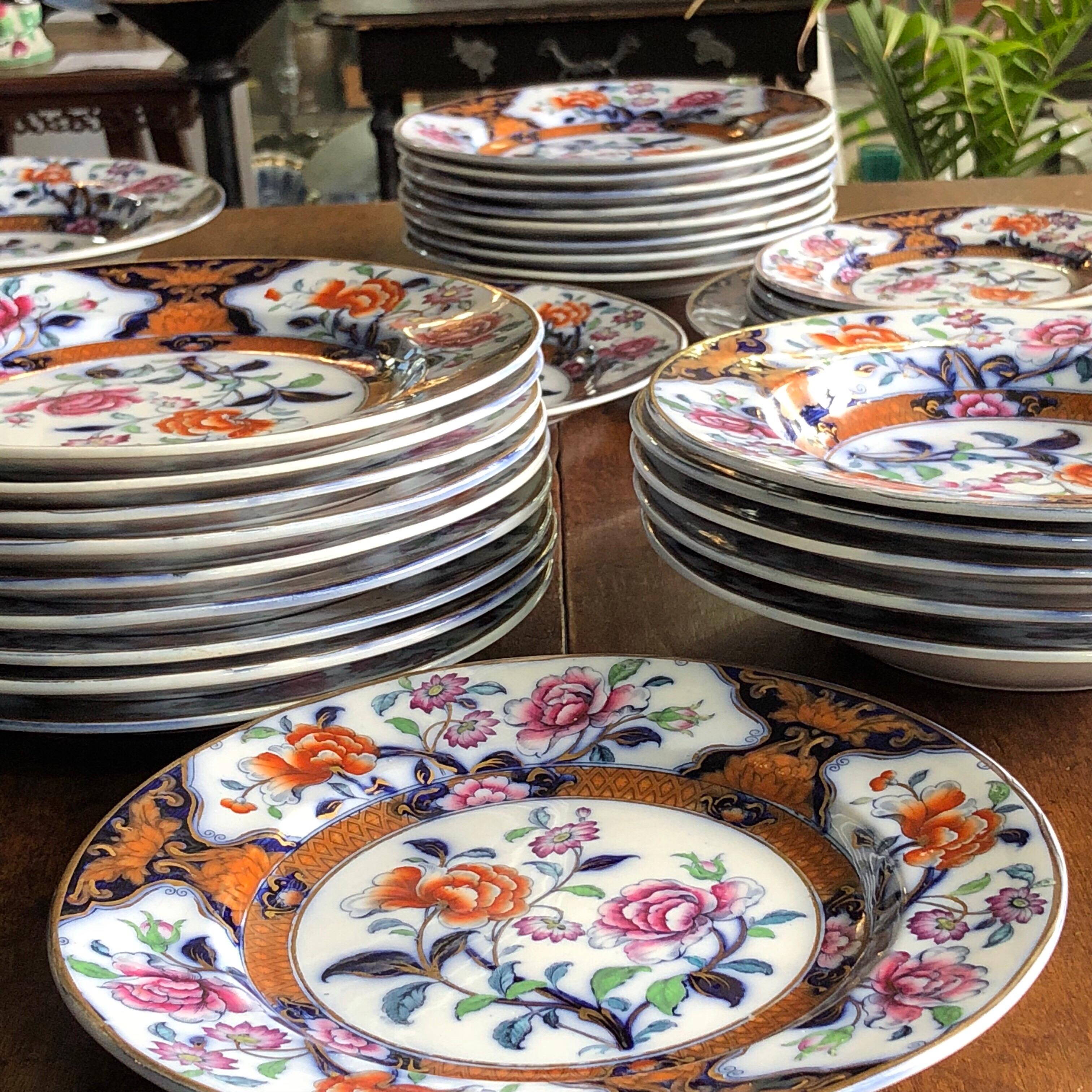 Handsome early Victorian ironstone service, richly decorated with enamel flowers and foliage within reserves on a deep blue ground, within gilt rims.

Pattern number 2/3186
most pieces marked ‘EUGE’NIE’ , impressed ‘PEARL’ and other marks,
circa