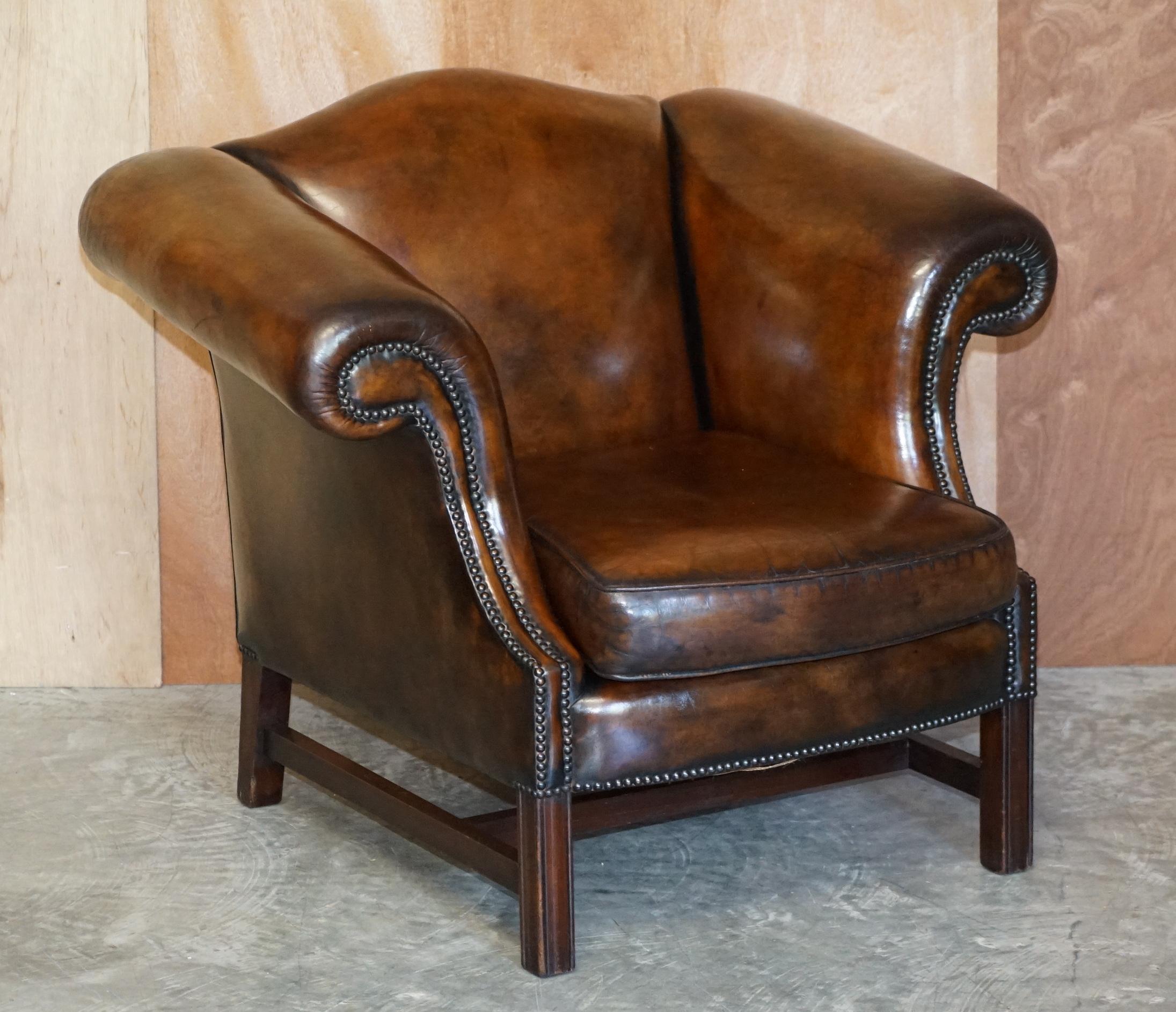 We are delighted to offer for sale this lovely pair of fully restored hand dyed brown leather camelback armchairs which is part of a large suite

Each piece is very comfortable, they all have padded and over stuffed backs, the leather has been