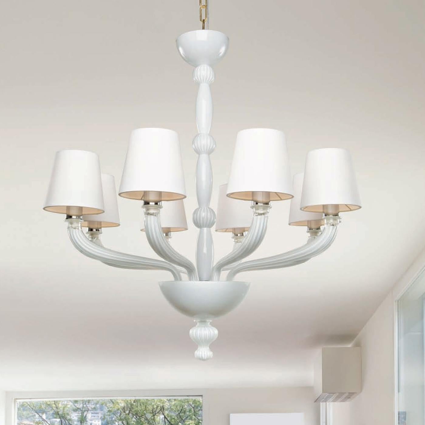 Masterfully crafted of white blown Murano glass, this modern chandelier is part of the Mazzega 1946 historical archives from the early 20th century. It is characterized by a sinuous central stem composed of alternating elliptical and spherical